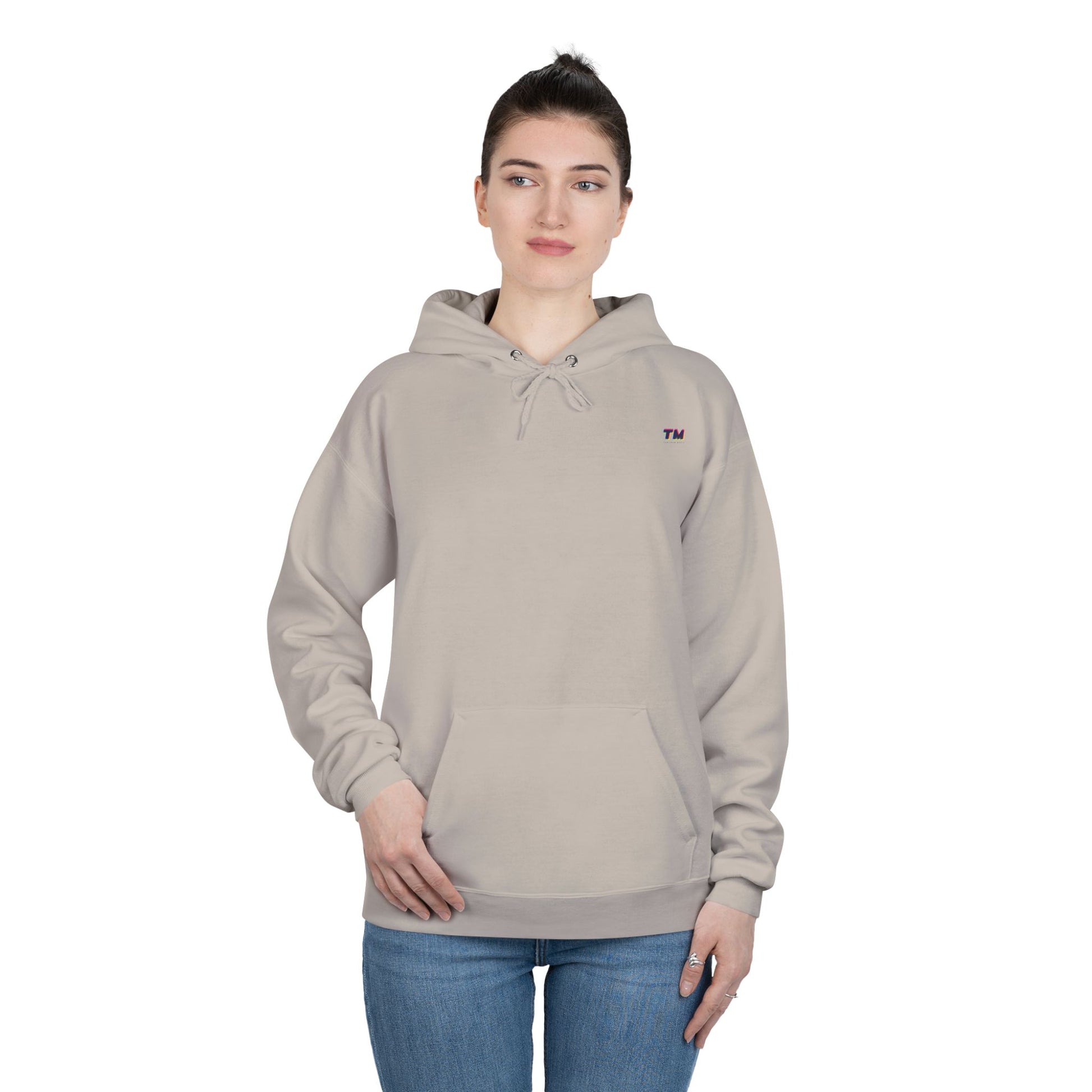 Woman wearing beige EcoSmart hoodie with relaxed fit.