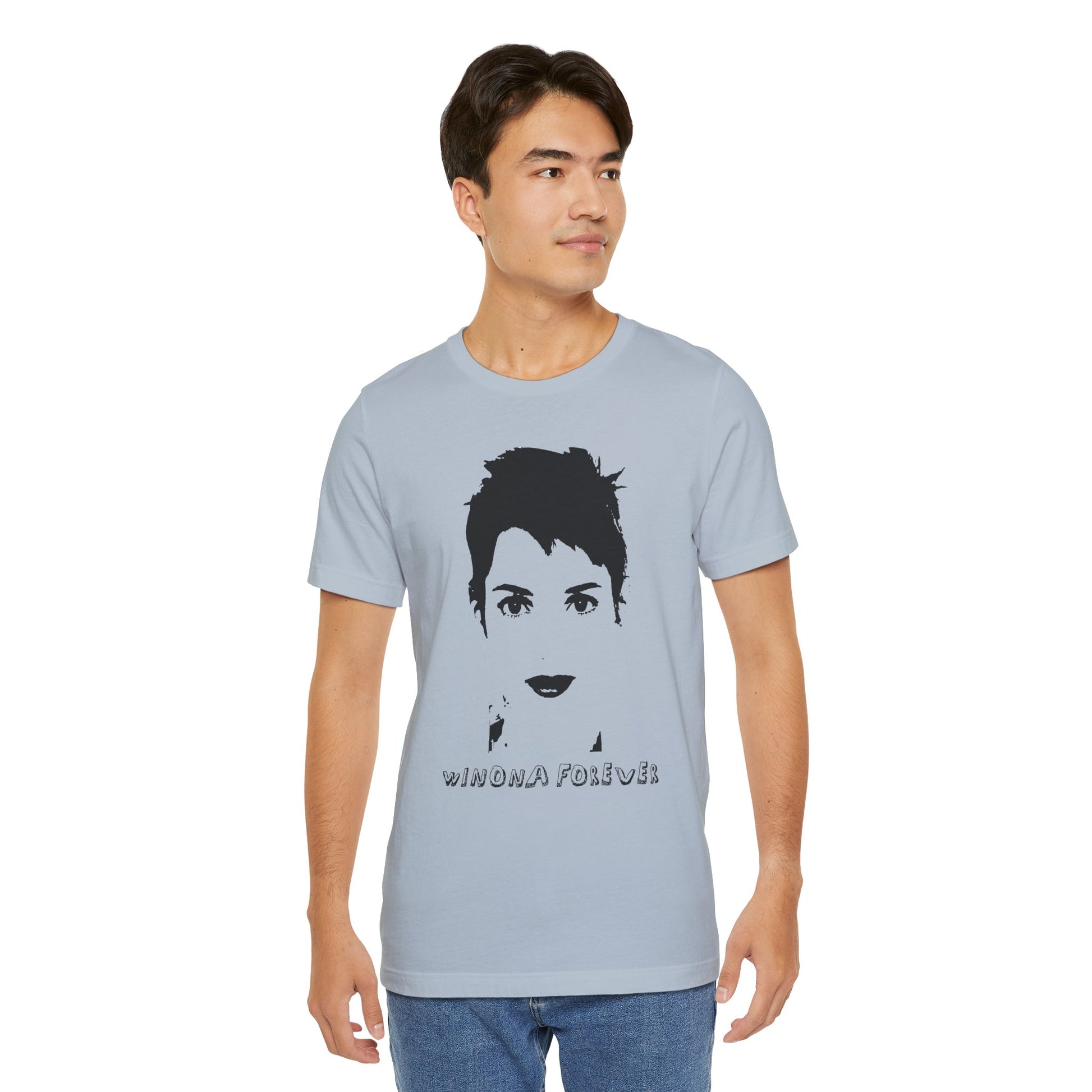 Man wearing light blue Winona Forever T-shirt with black portrait and “Winona Forever” text.