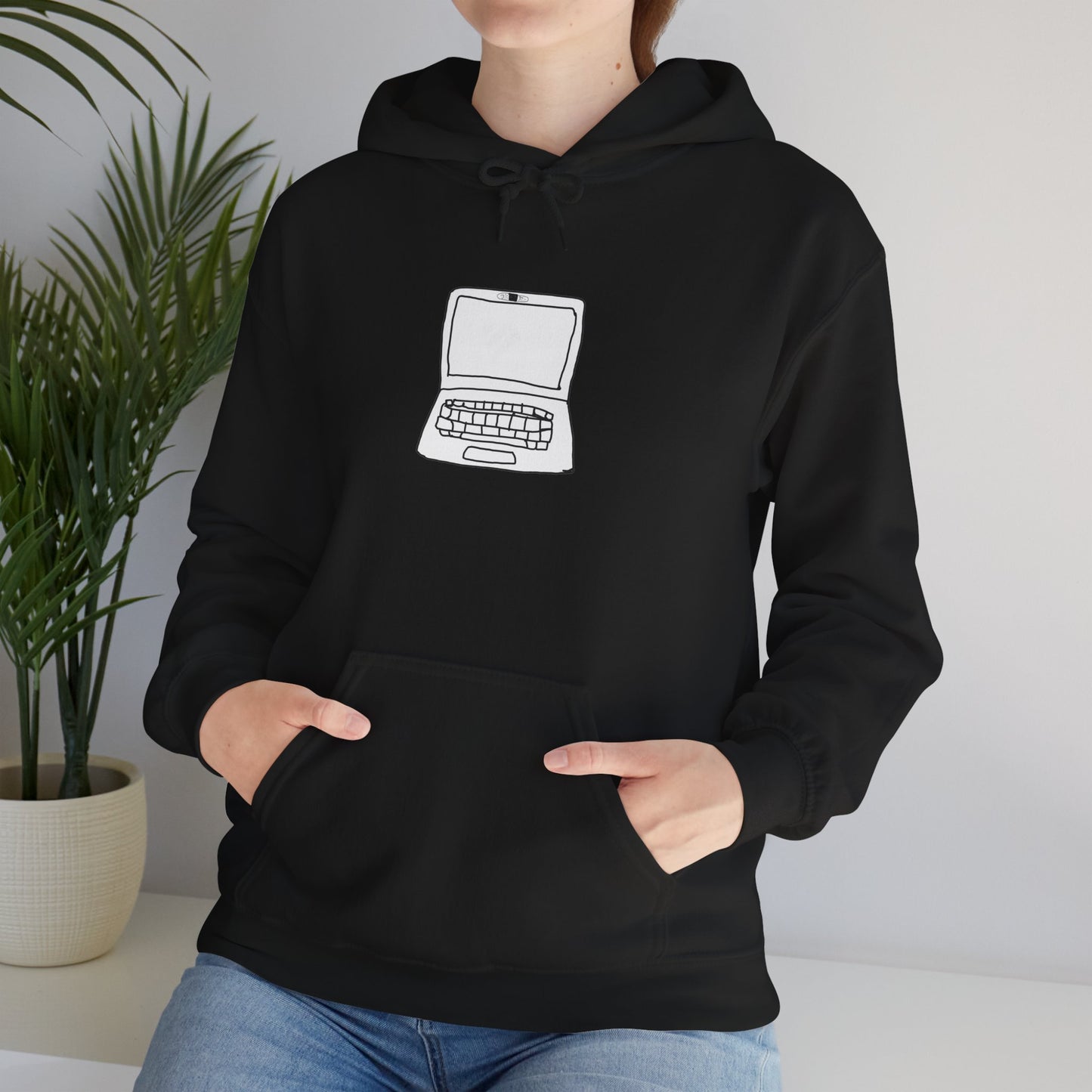 Person wearing black Unisex Laptop No Cam Hoodie indoors