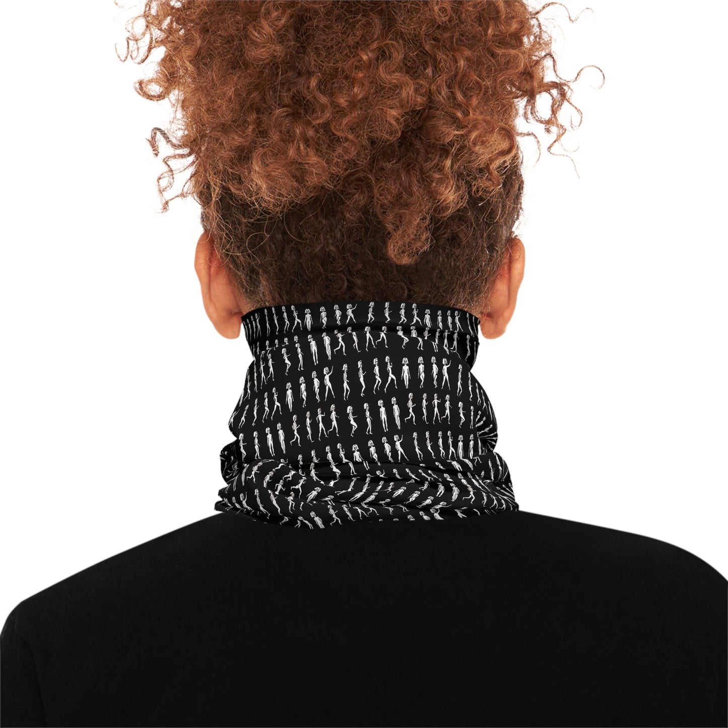 Back view of woman wearing black patterned tube scarf around neck
