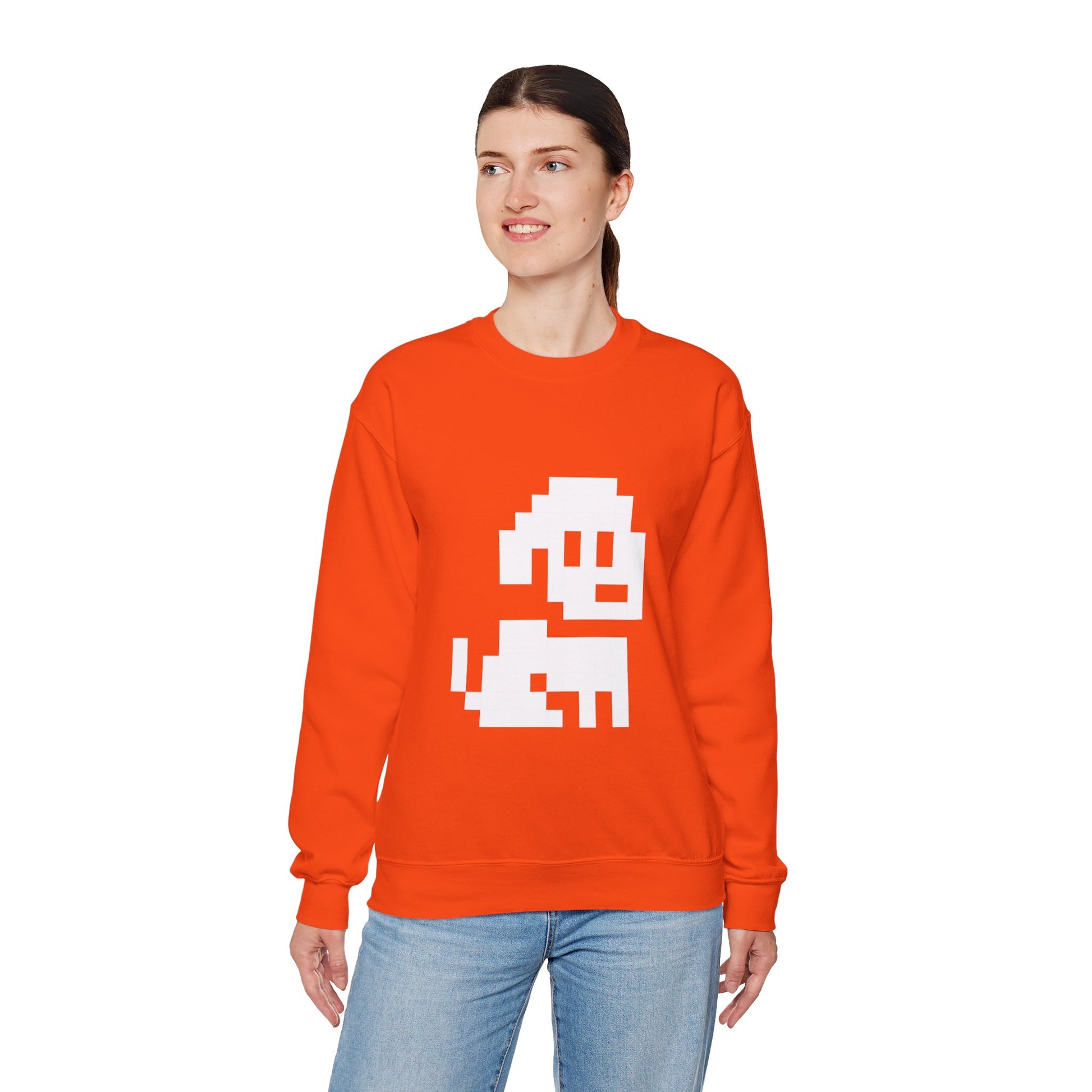 Person wearing an orange sweatshirt with a white graphic design on a white background