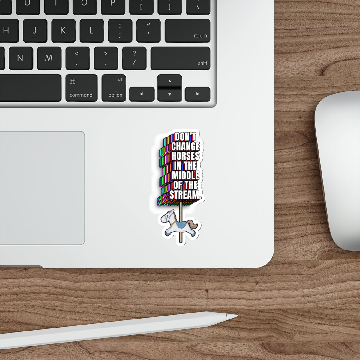 Sticker with Don’t Change Horses in the Middle of the Stream design applied to a laptop