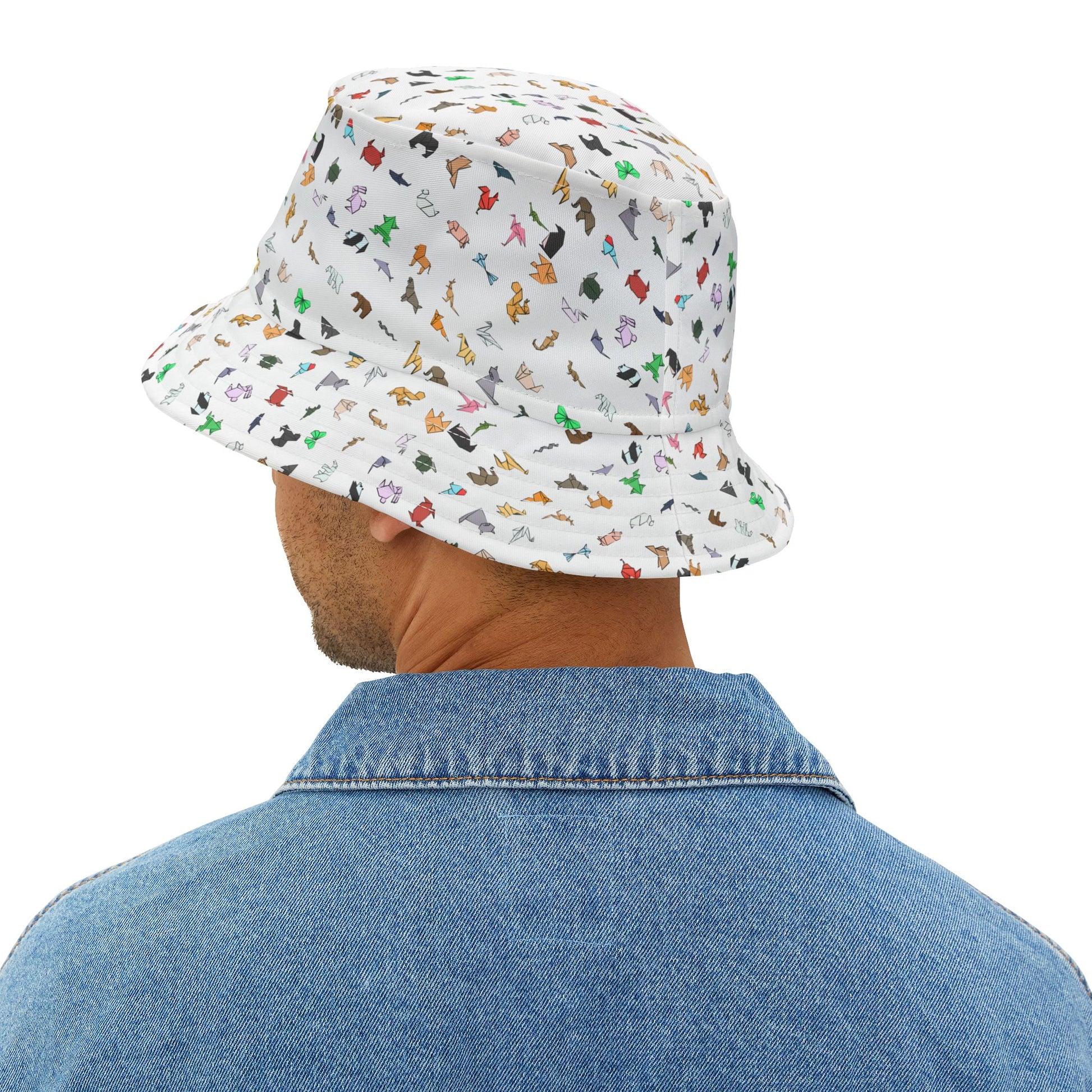 Back view of man wearing patterned bucket hat with colorful origami animal design