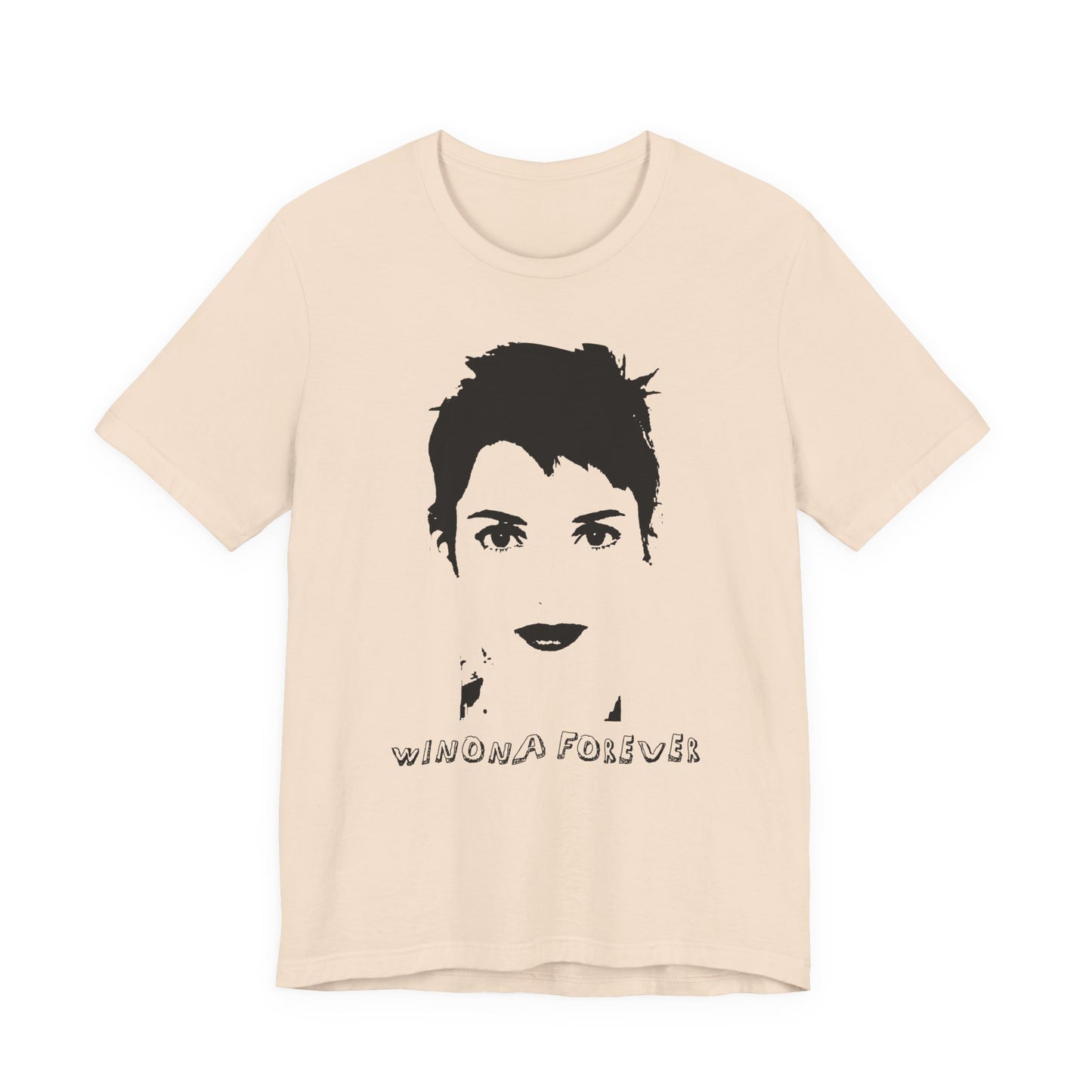 Beige t-shirt with black graphic of a face and 'WINONA FOREVER' text on a white background