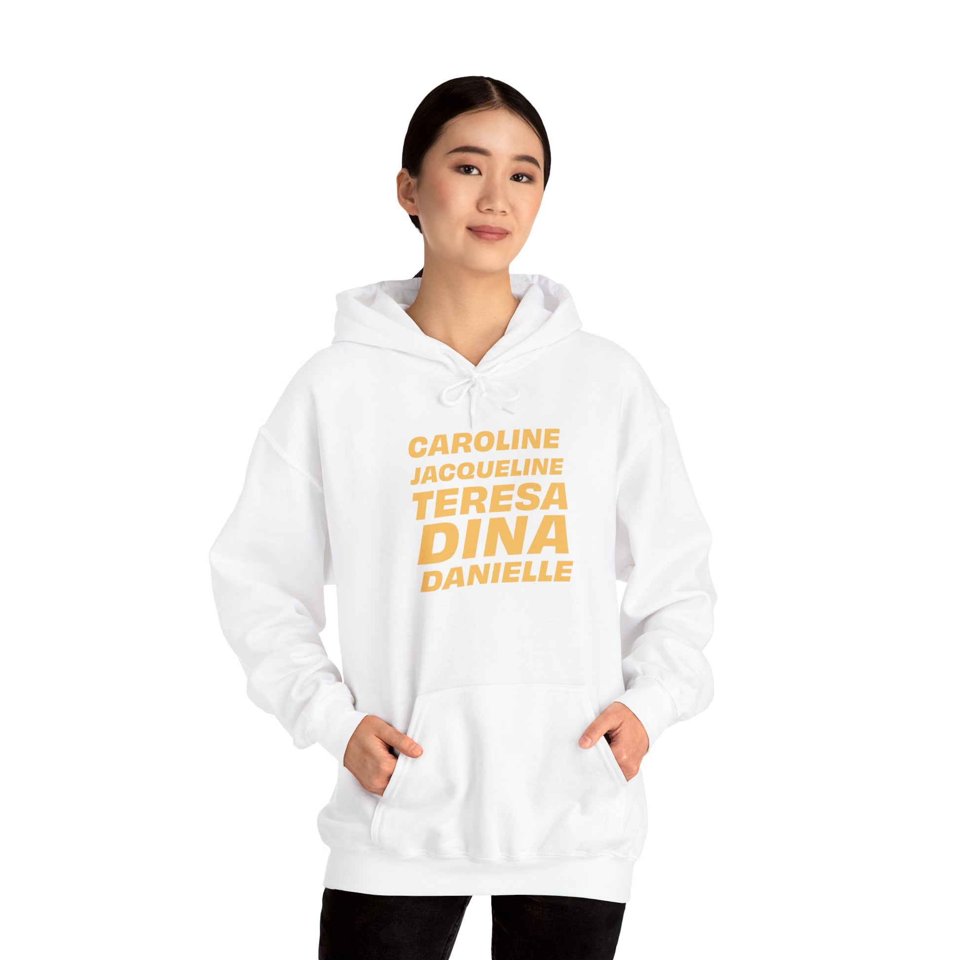 Female model wearing white OG NJ Housewives Hooded Sweatshirt with hands in kangaroo pocket.