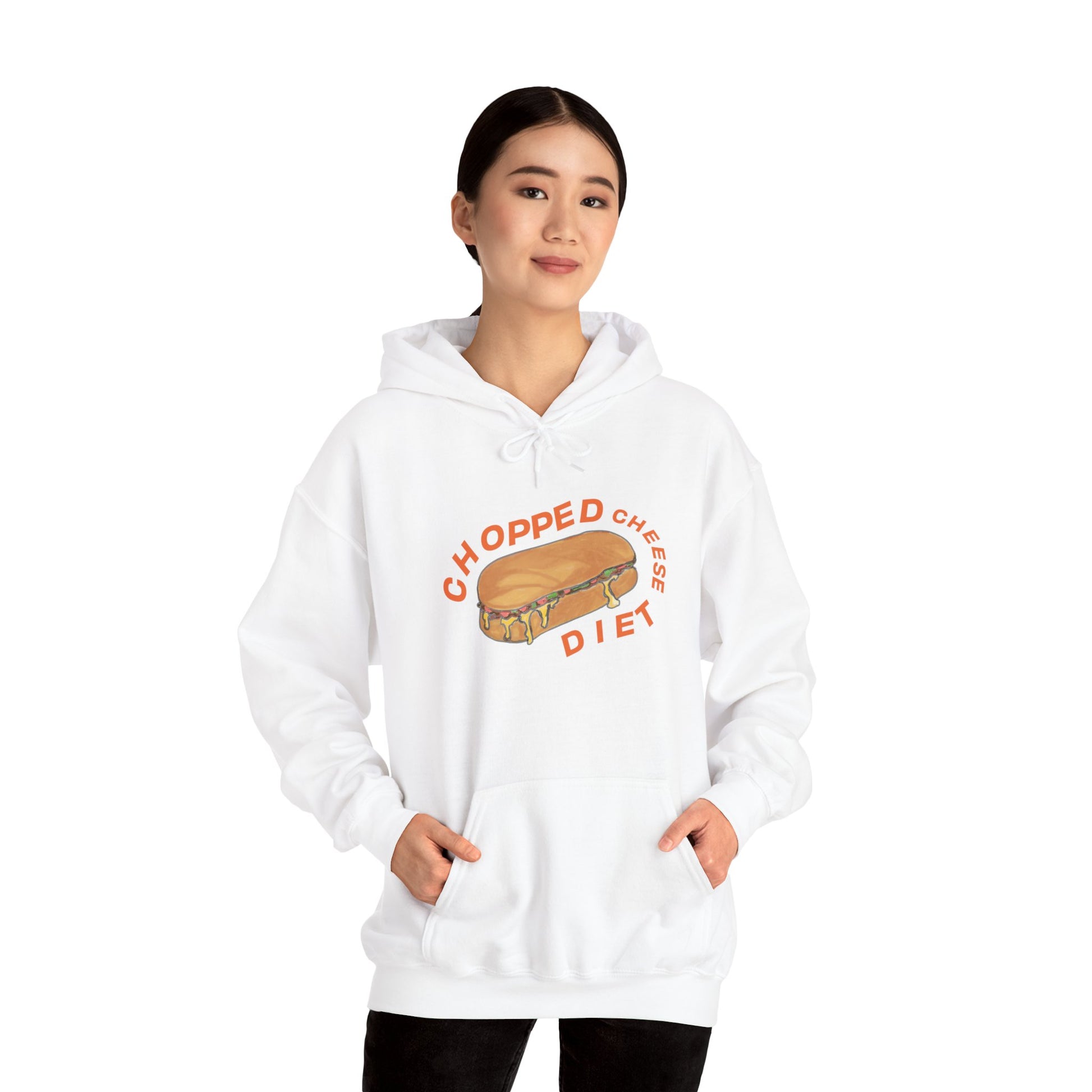 Person wearing white hoodie with “Chopped Cheese Diet” sandwich graphic, hands in front pocket.