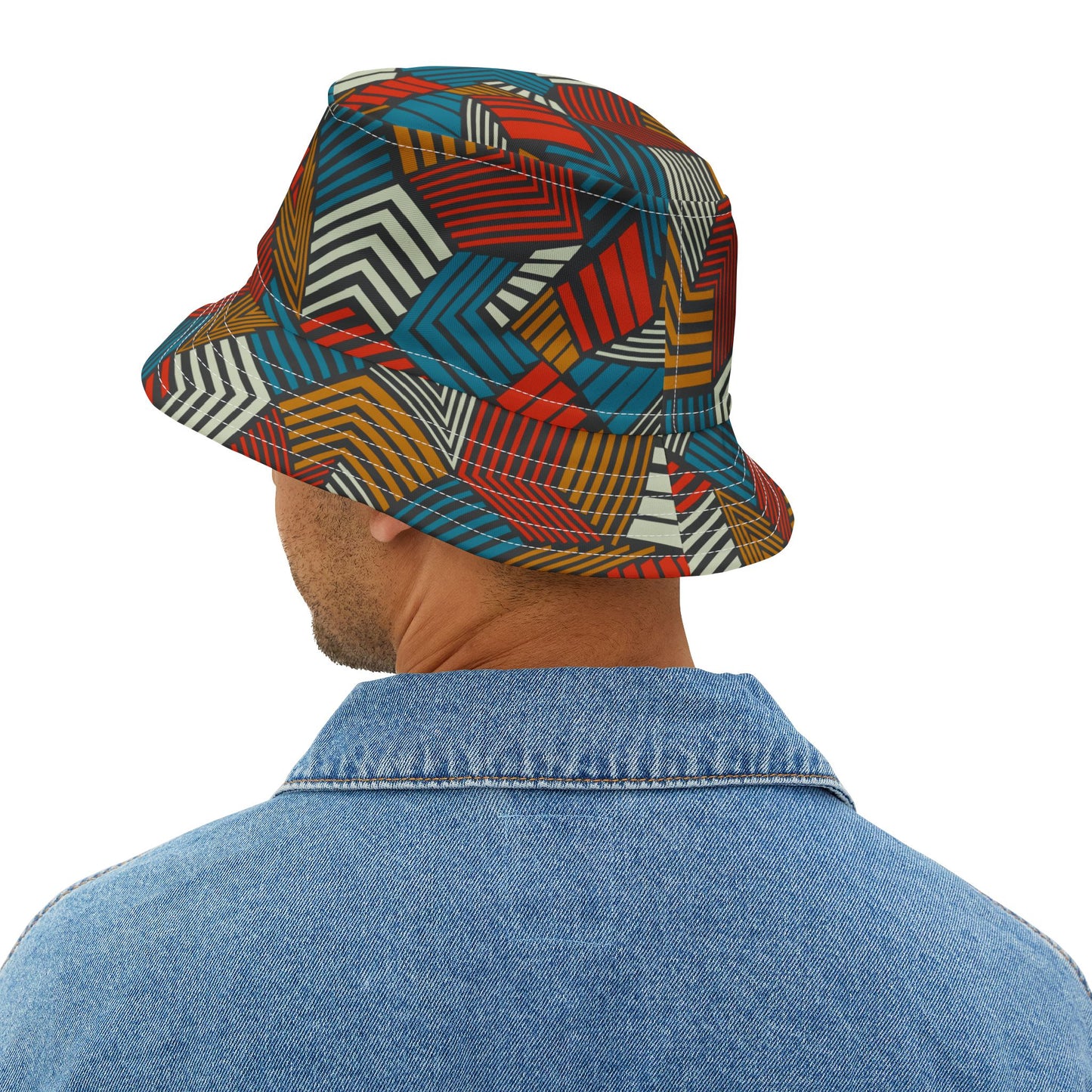 Person wearing a colorful geometric-patterned bucket hat on a white background