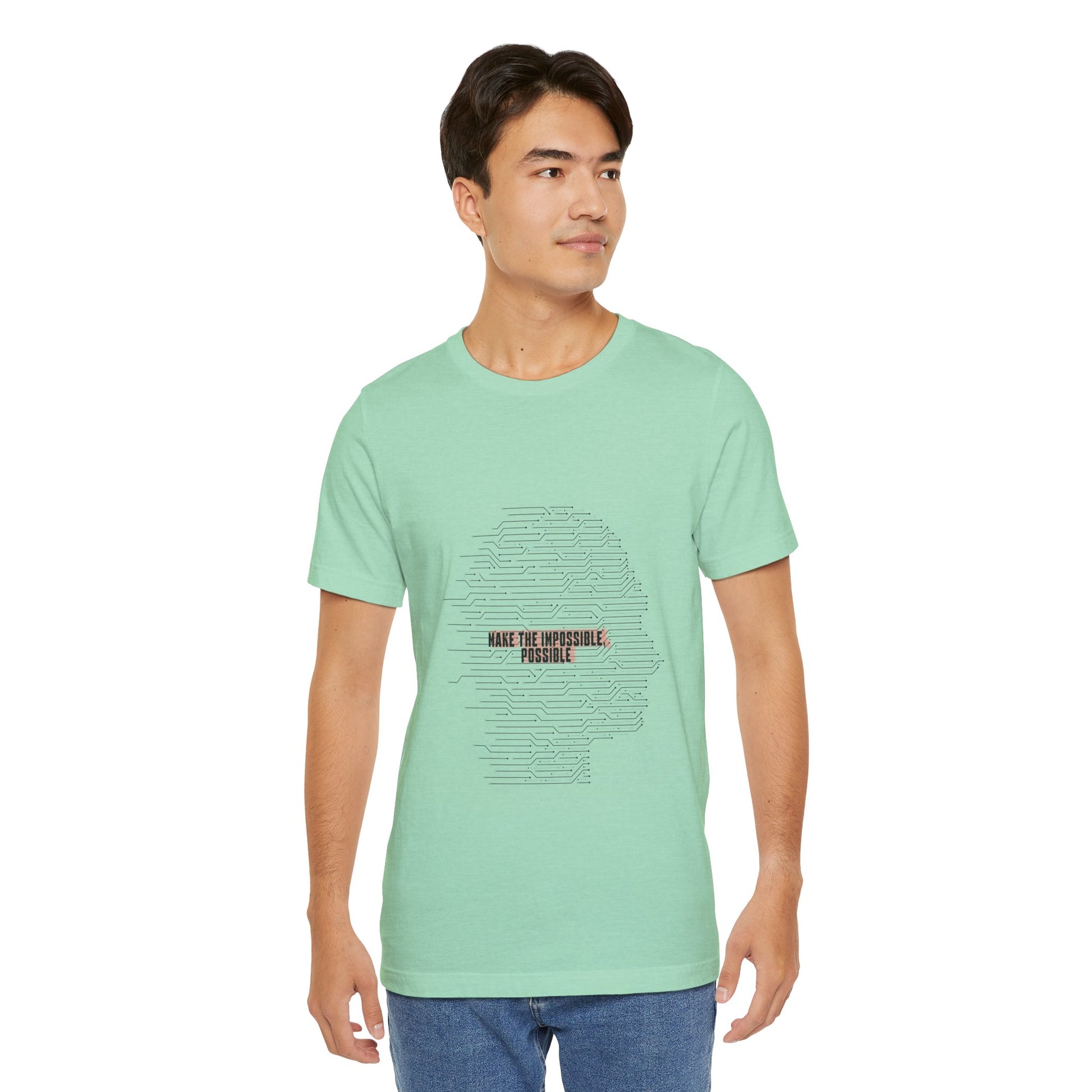 Man in green Make It Possible T-Shirt with bold empowering design.
