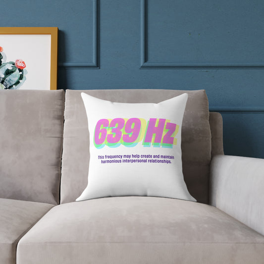 639 Hz frequency polyester pillow on a grey sofa, modern decor accent