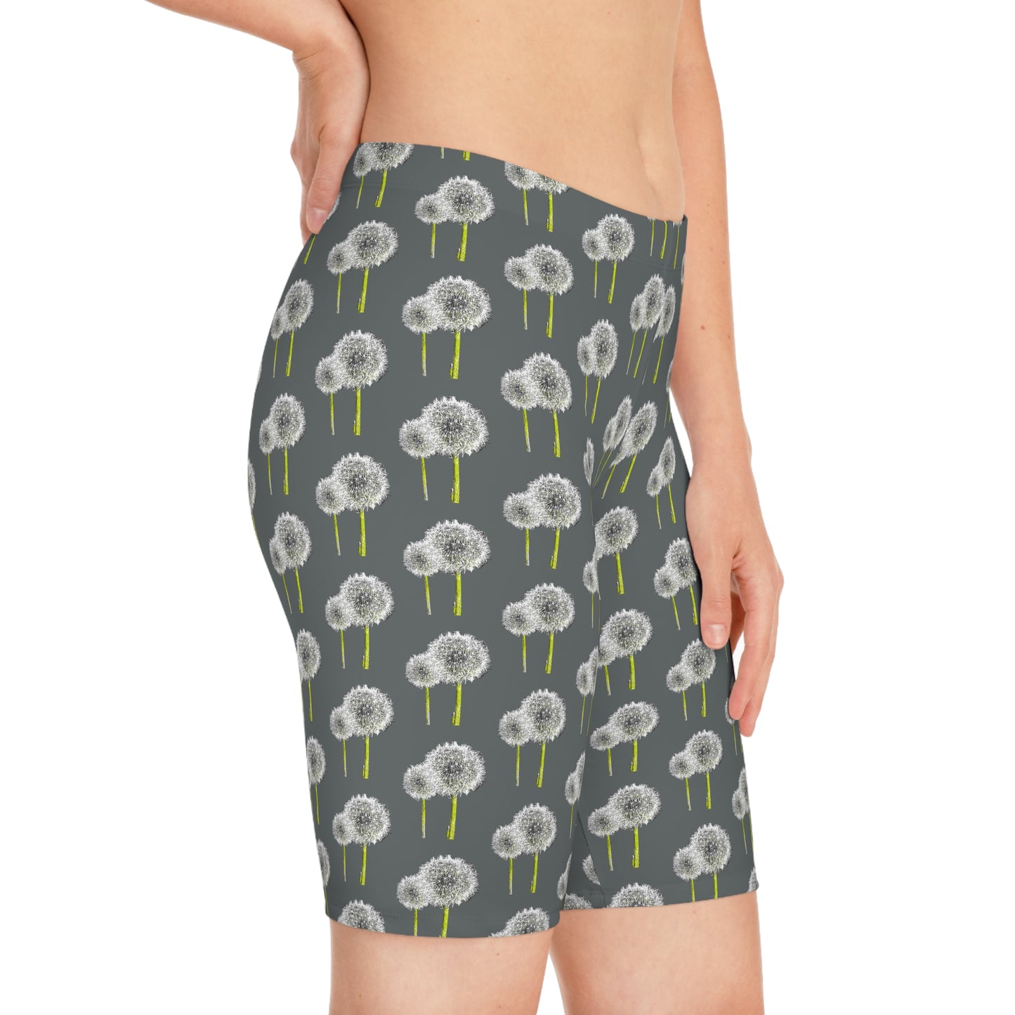 Side view of woman wearing Dandelion Women’s Bike Shorts with gray base and white dandelion print