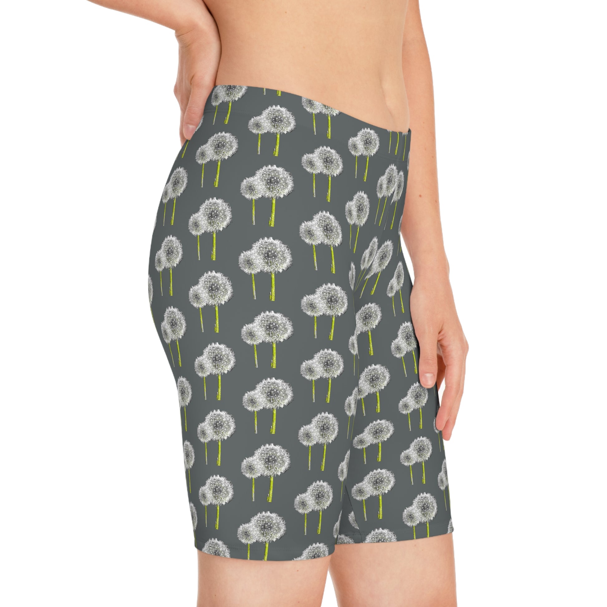 Side view of woman wearing Dandelion Women’s Bike Shorts with gray base and white dandelion print