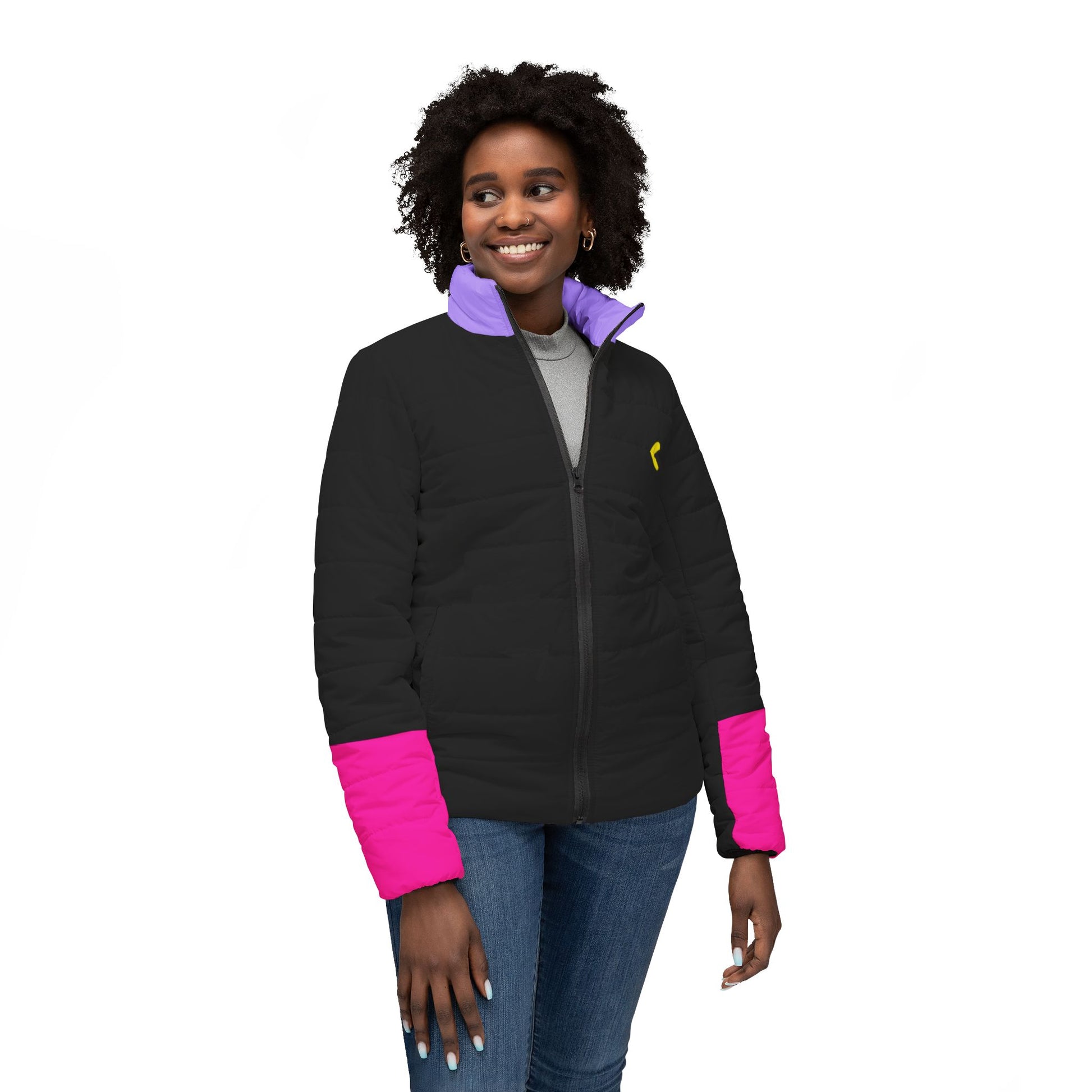 Model facing front wearing Pac-Man women’s black puffer jacket with yellow logo and color-blocked details