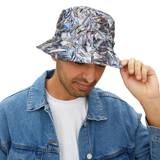 Man wearing Tinfoil Bucket Hat with metallic foil design, holding brim while looking down