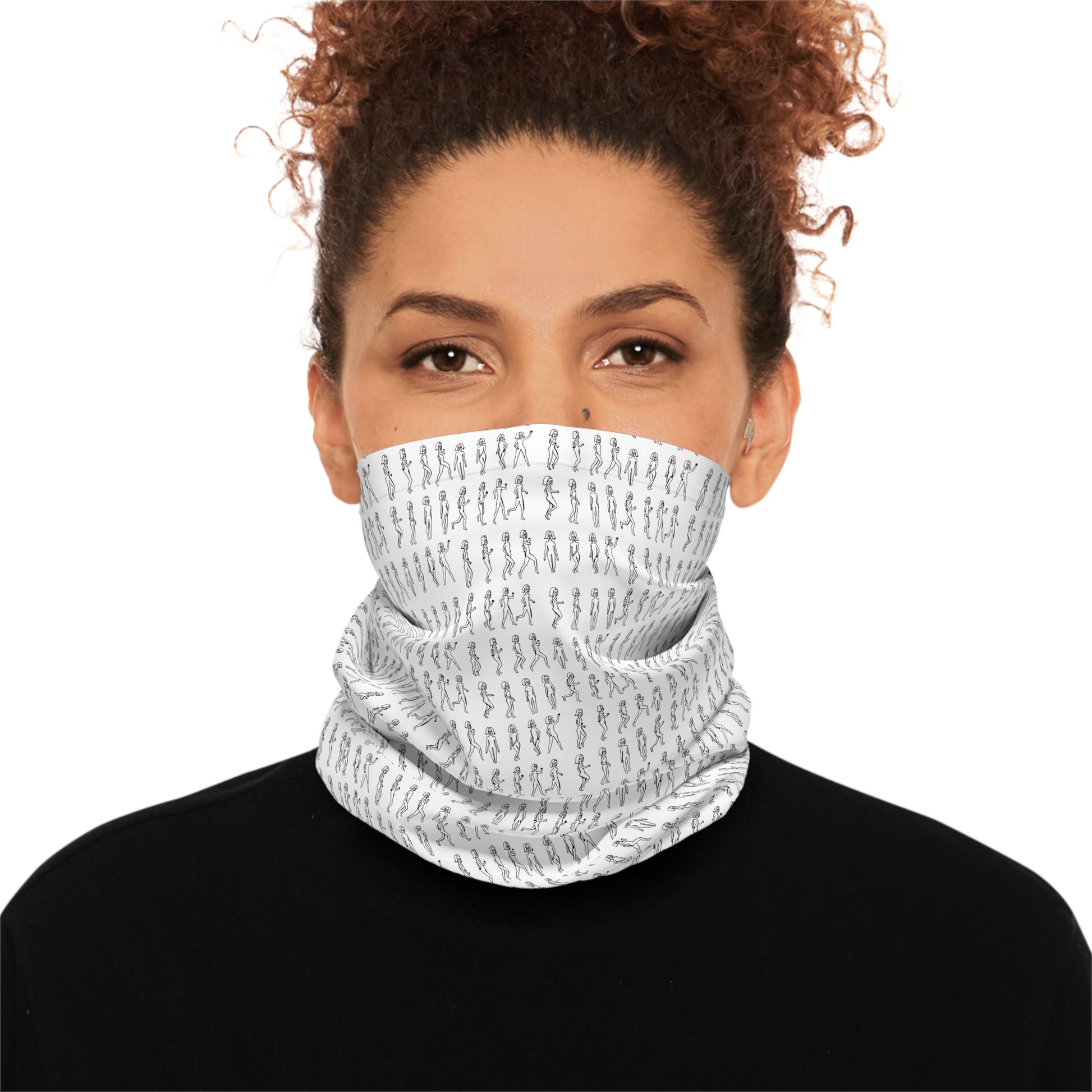 Person wearing a white patterned face mask on a white background
