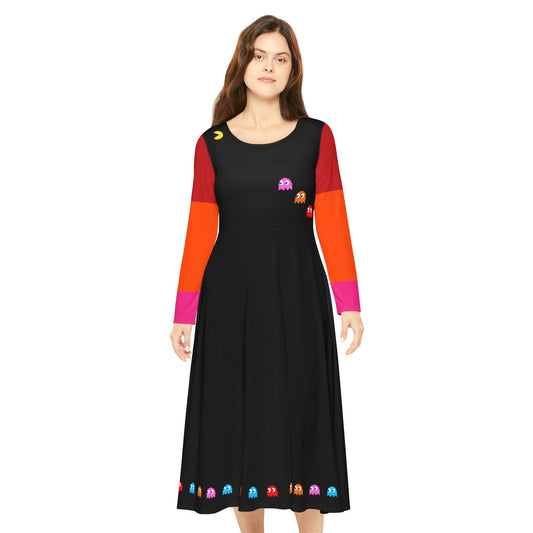 Female model wearing a long-sleeved A-line dress featuring a retro video game theme, with colorful ghost characters and a pixel-style yellow character reminiscent of Pac-Man on a black background, and bright red-orange-pink gradient sleeves.

