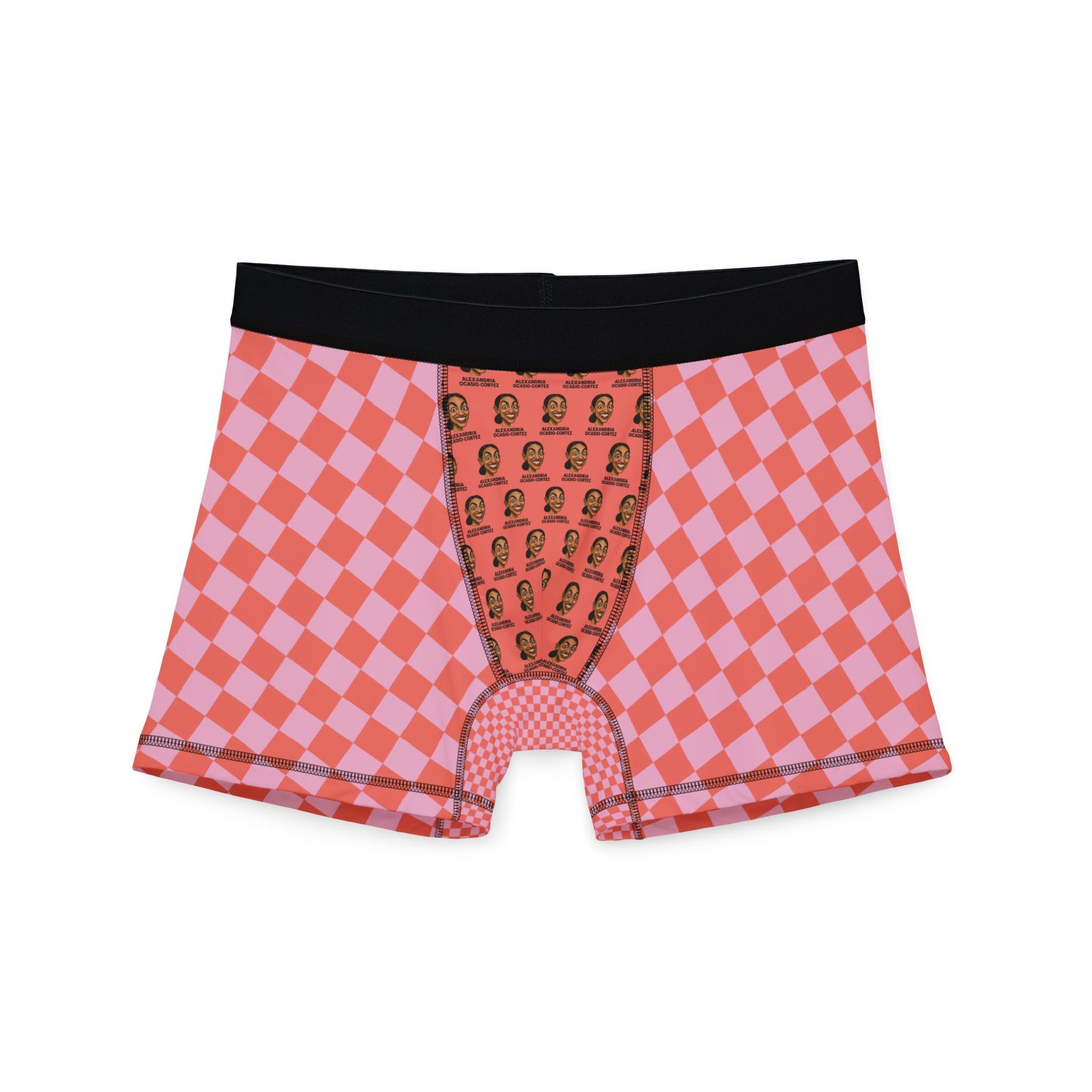 Flat lay of pink and red checkered boxer briefs with black waistband and AOC face pattern on pouch area.