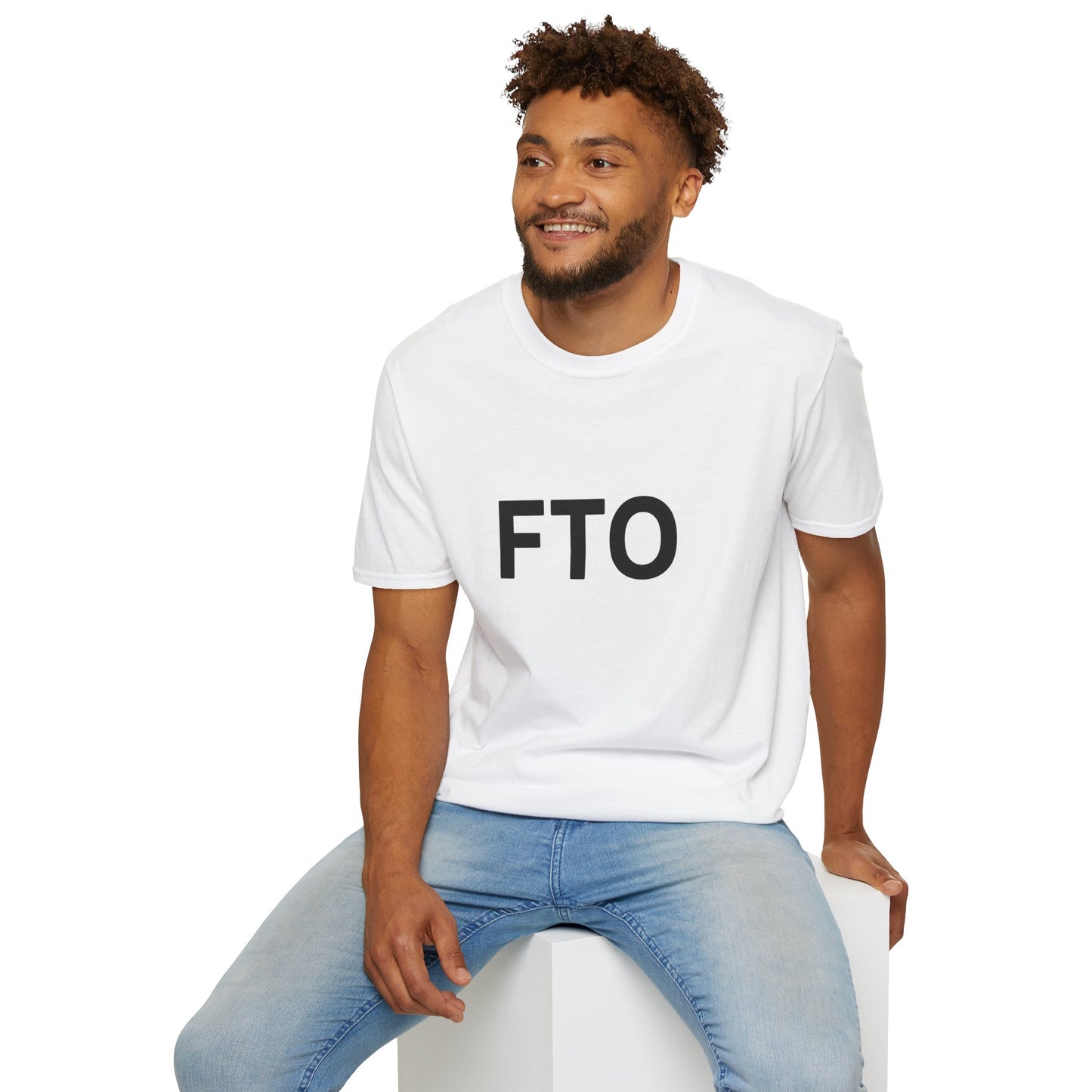 Man sitting casually wearing white FTO T-shirt and jeans