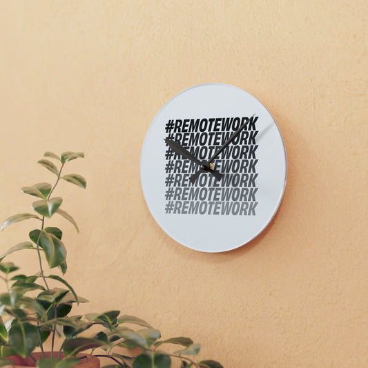 Wall clock with '#REMOTEWORK' text on a beige wall with a plant in the foreground