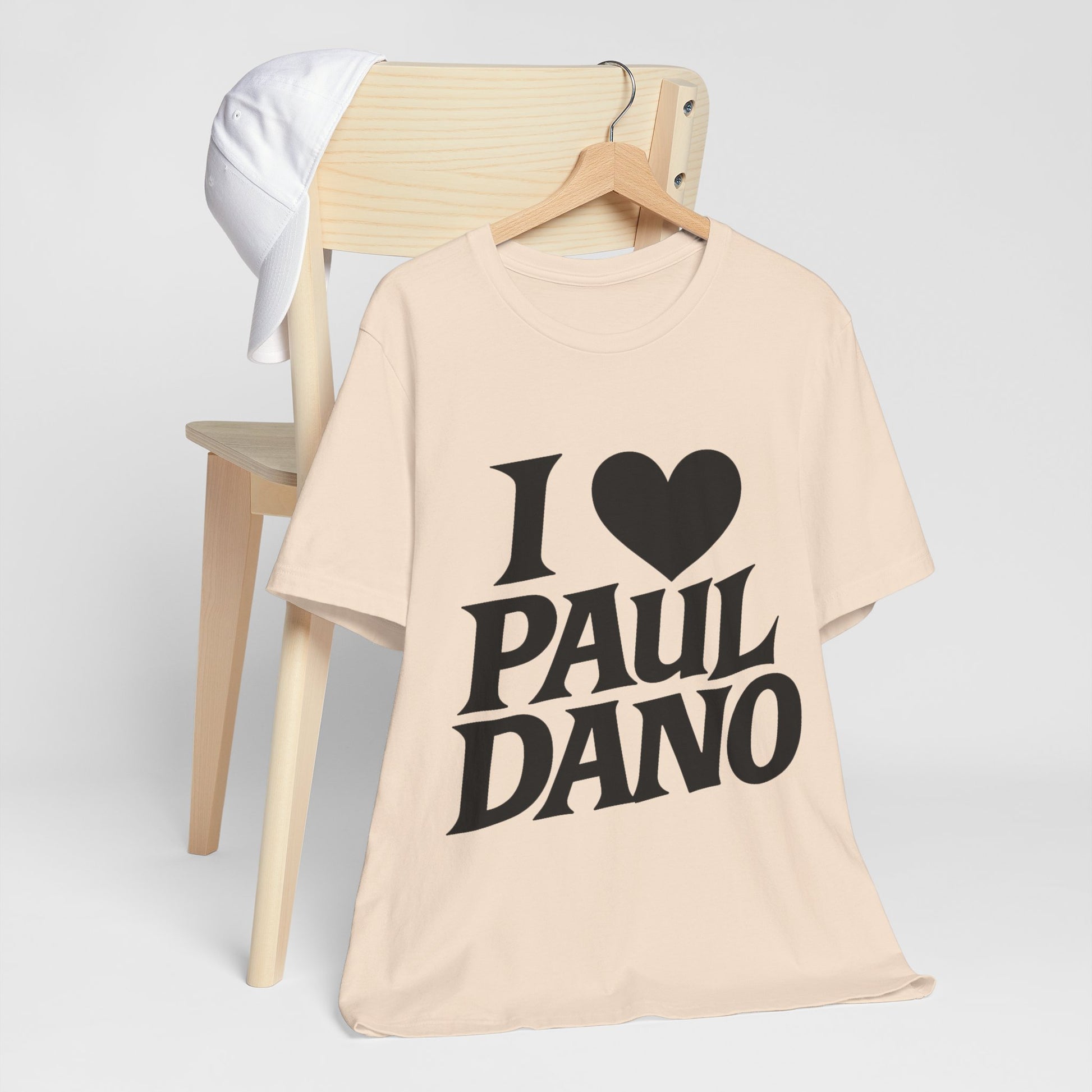 Beige t-shirt with 'I ❤️ Paul Dano' text on a white background