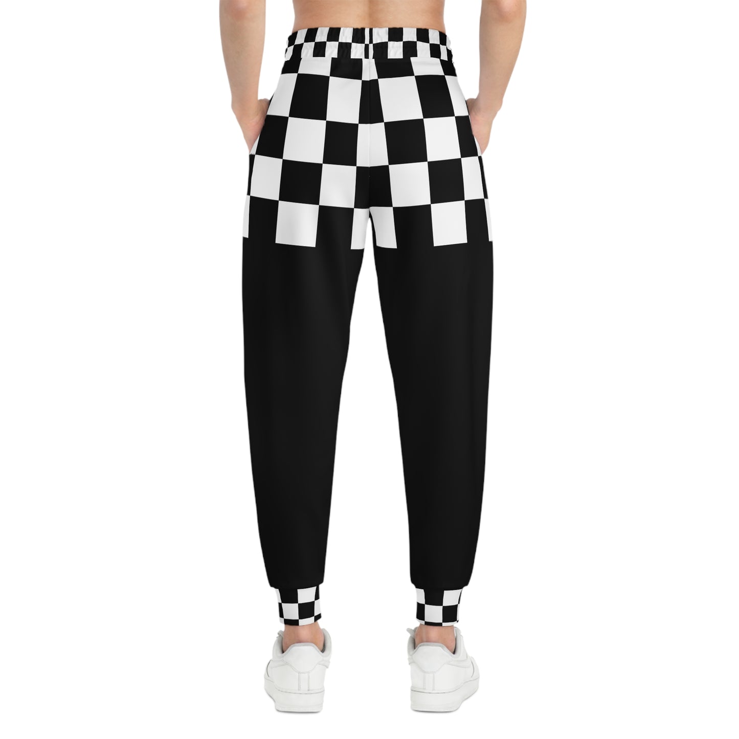 Black and white checkered pants worn by a person on a white background