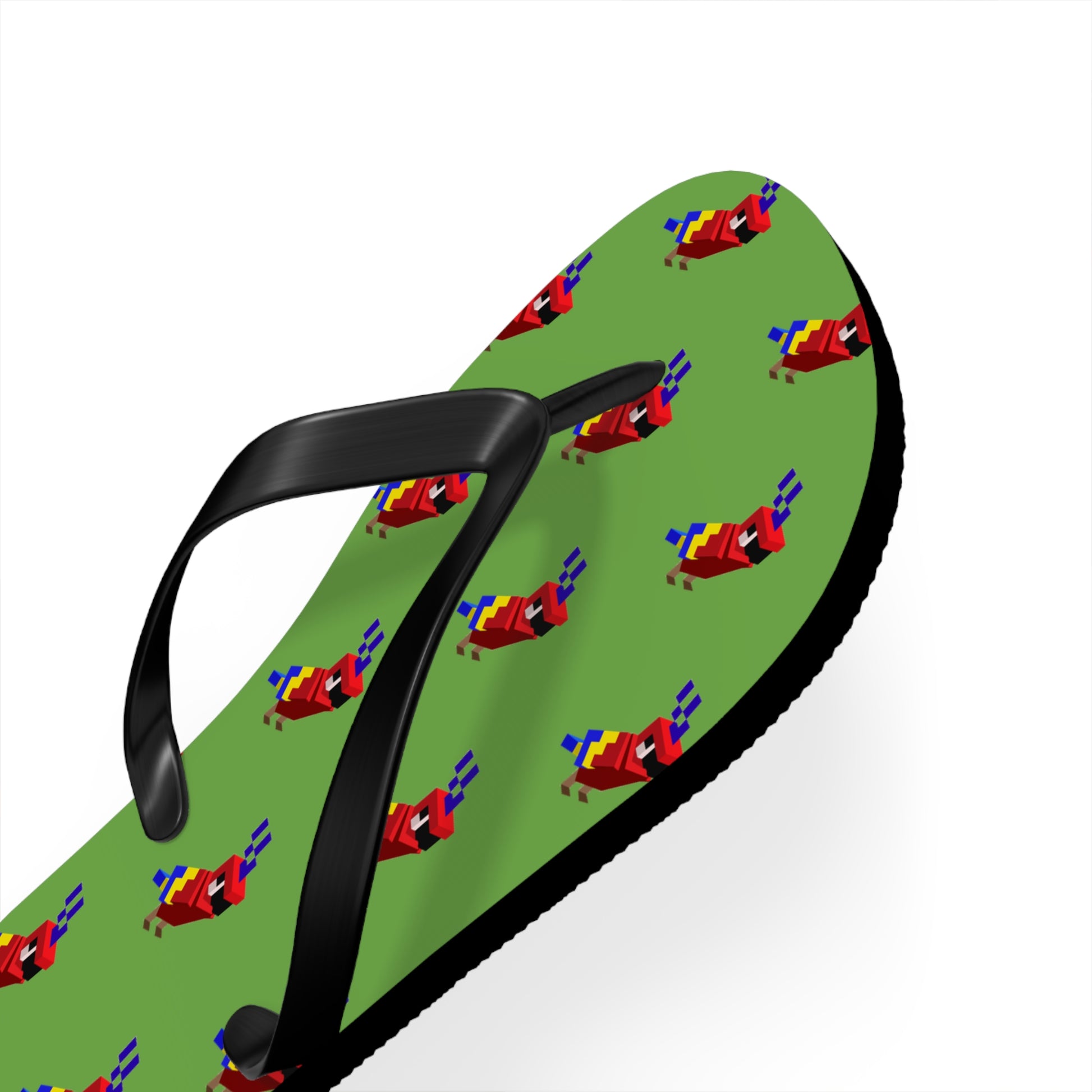 Close-up angled view of green arcade parrot flip flops showing parrot print and black straps