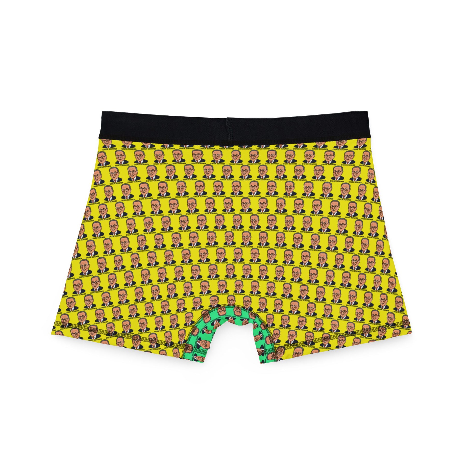 Back view of Chuck Schumer face print boxer briefs with yellow pattern and black waistband, laid flat