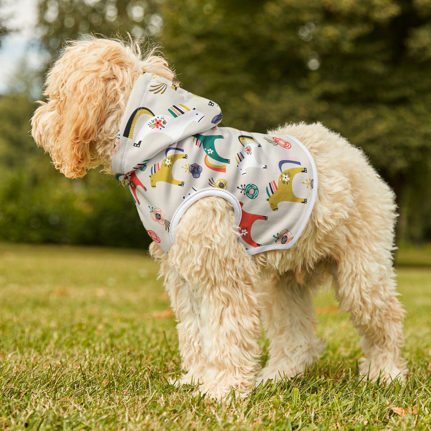 Dog standing on grass in Horses Pet Hoodie looking to the side