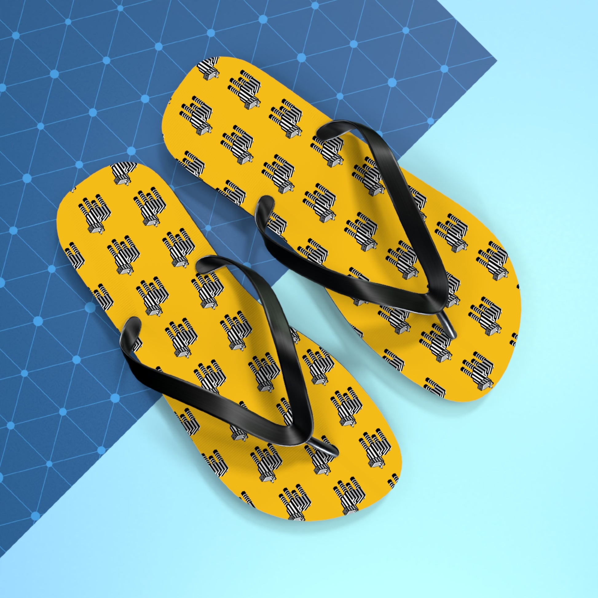 Arcade Zebra Flip Flops on a geometric blue background showing bold yellow design.