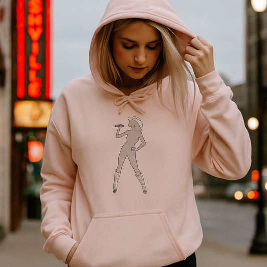 Model wearing blush Bey Country Unisex Fleece Hoodie, line dance silhouette graphic front, city street at dusk.