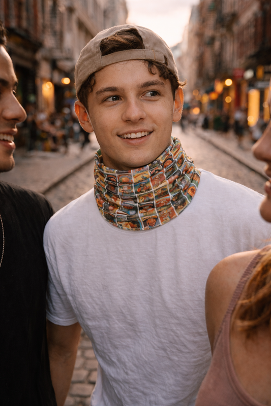 Unisex neck gaiter with retro trading card collage pattern worn outdoors on city street