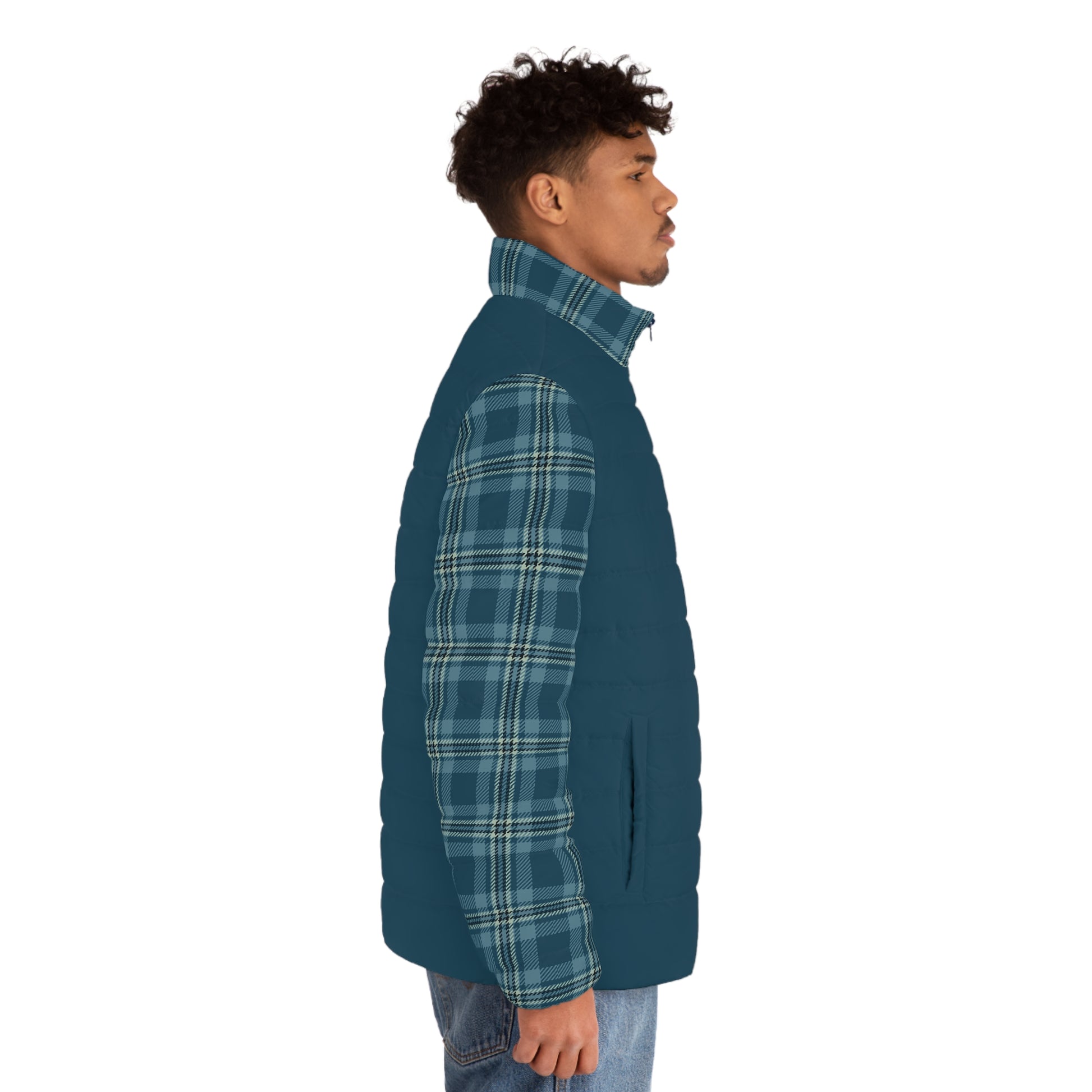 Man wearing a teal quilted jacket with plaid pattern on a white background