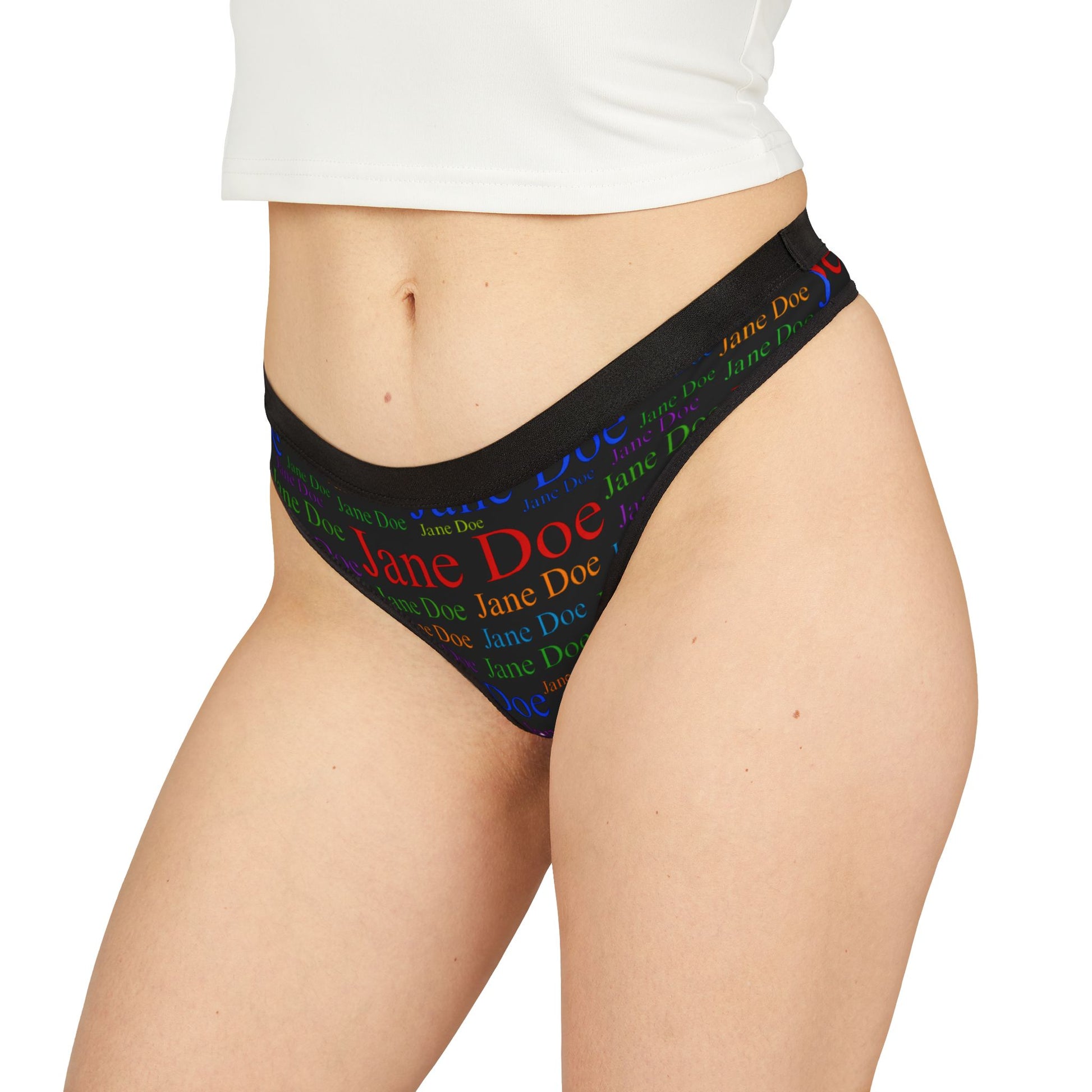 Front view of Jane Doe Women’s Thongs – Black Edition with multicolor text print