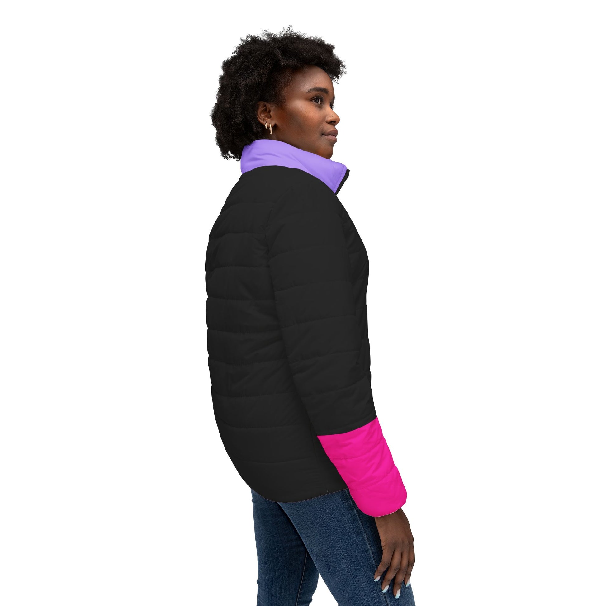 Model wearing Pac-Man women’s black puffer jacket outdoors at sunset near a lake, casual styled look