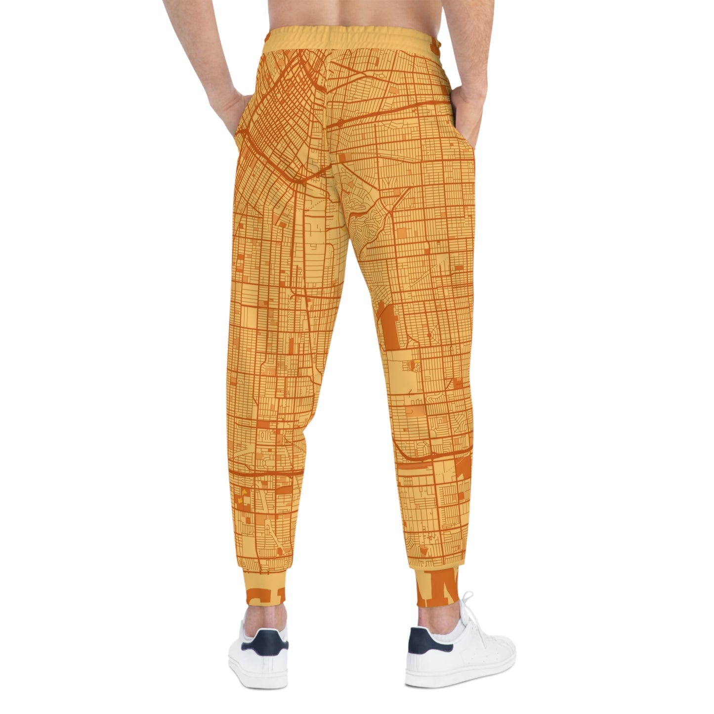 Model wearing LA map joggers back view with clear city grid print and cuffed hems.