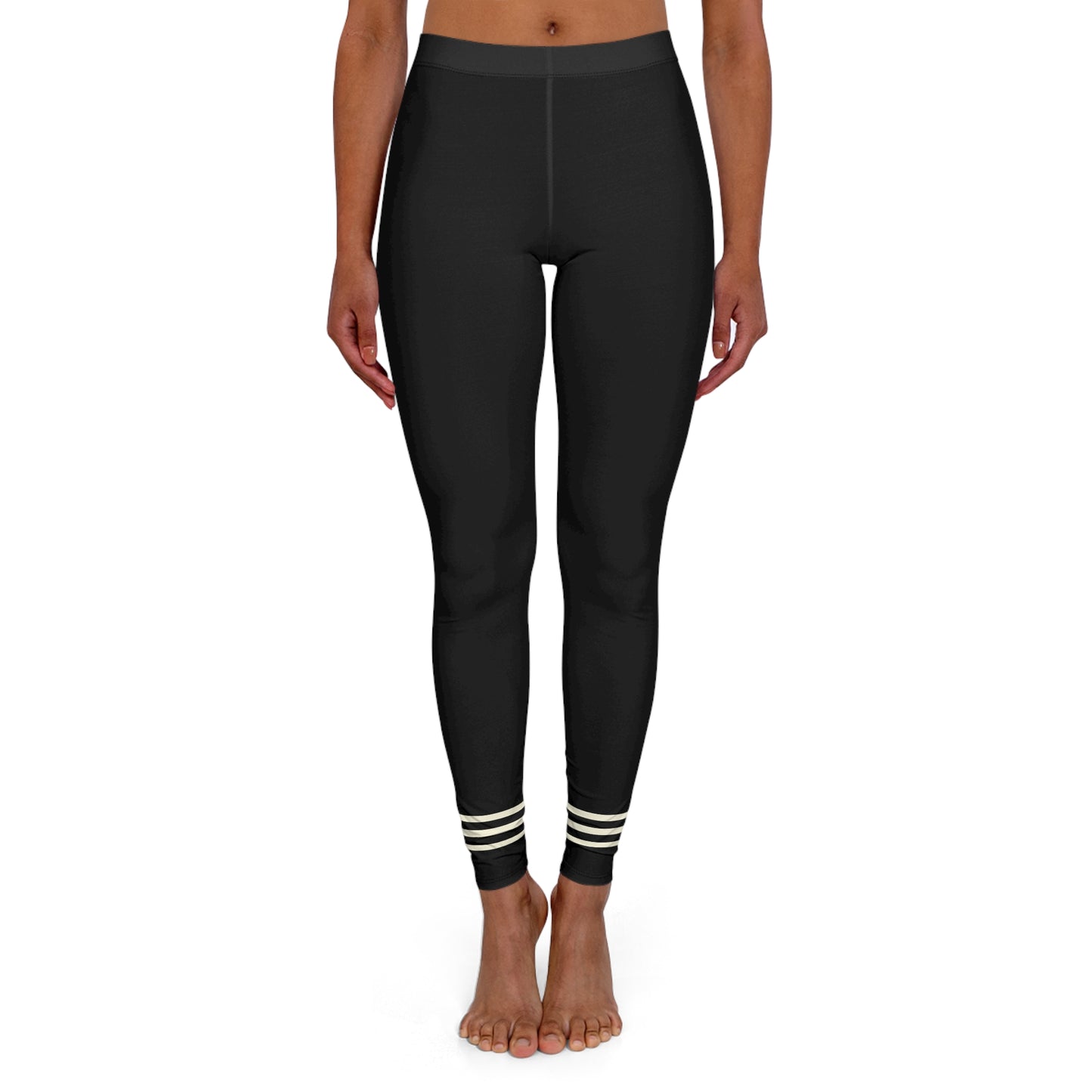 Front view of black leggings with striped ankle cuffs.