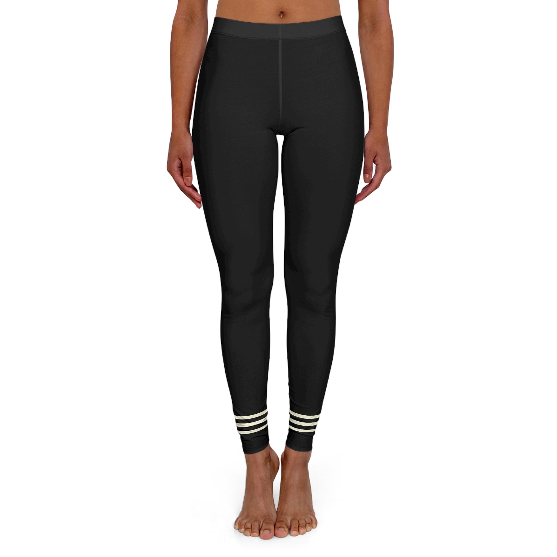 Front view of black leggings with striped ankle cuffs.