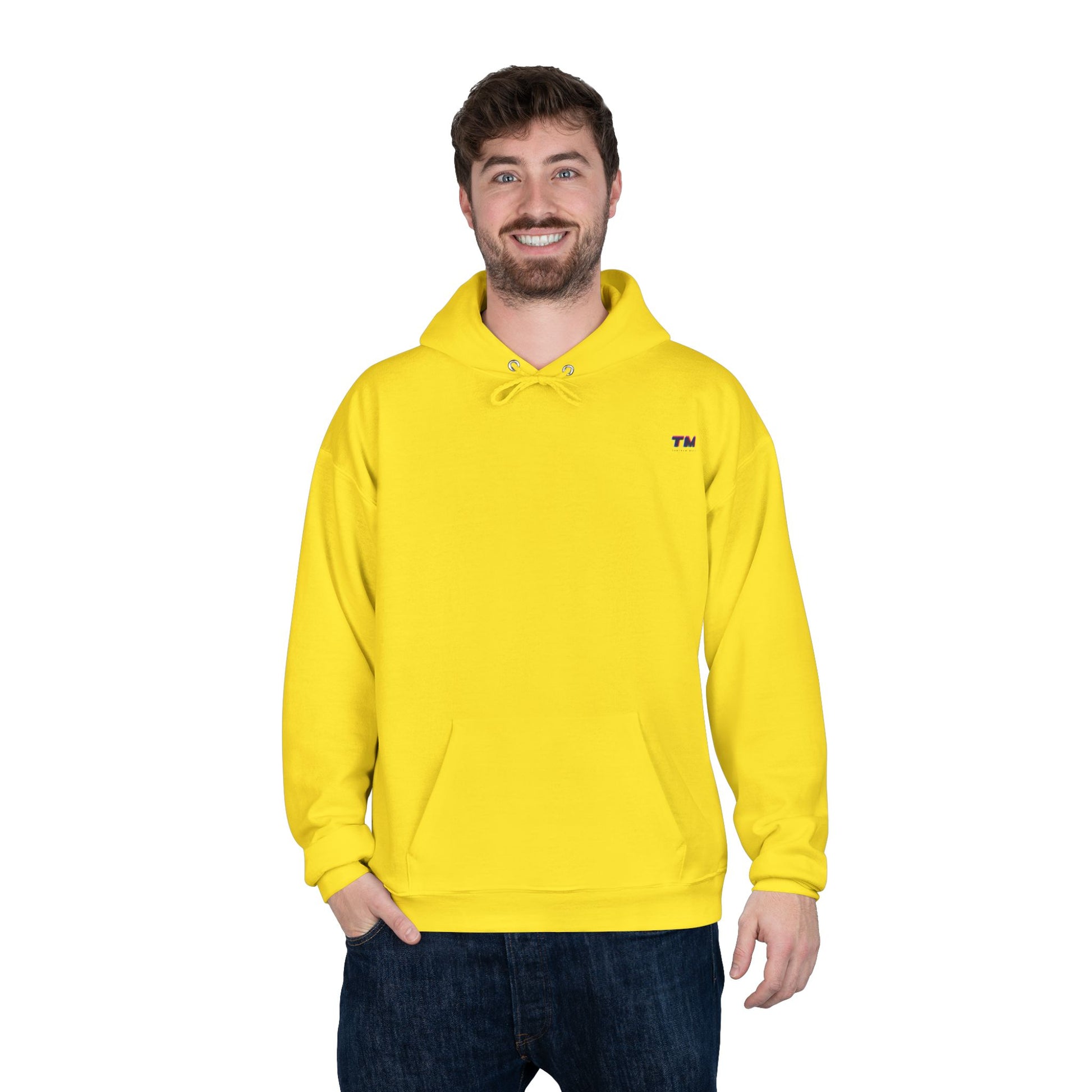 Man wearing bright yellow EcoSmart hoodie with relaxed stance.