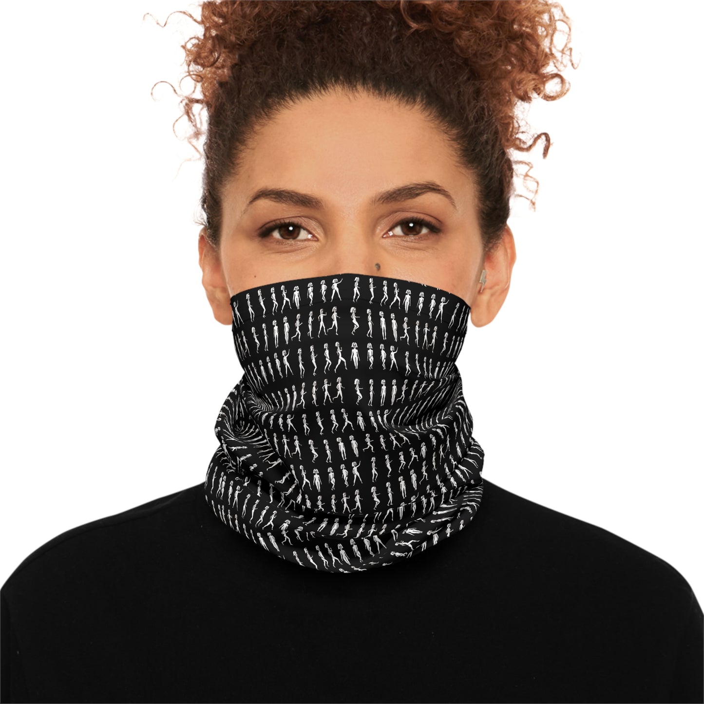 Woman wearing black patterned tube scarf covering lower face and neck