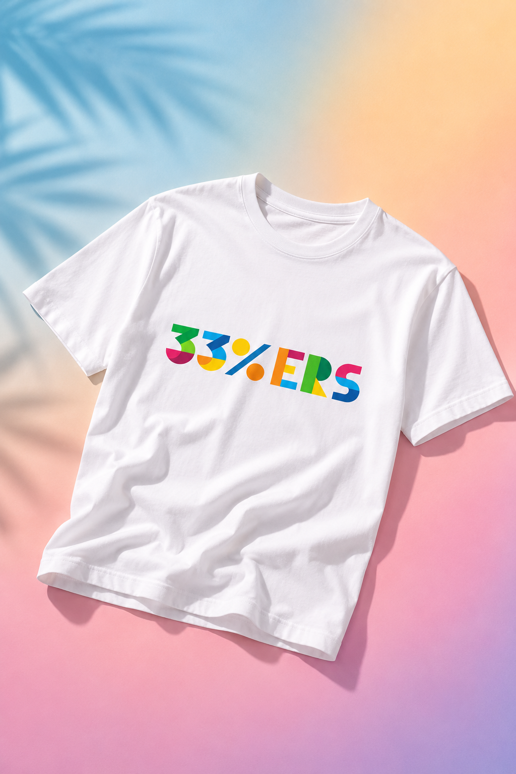 White 33%ERS graphic t-shirt flat lay on soft pastel gradient background.