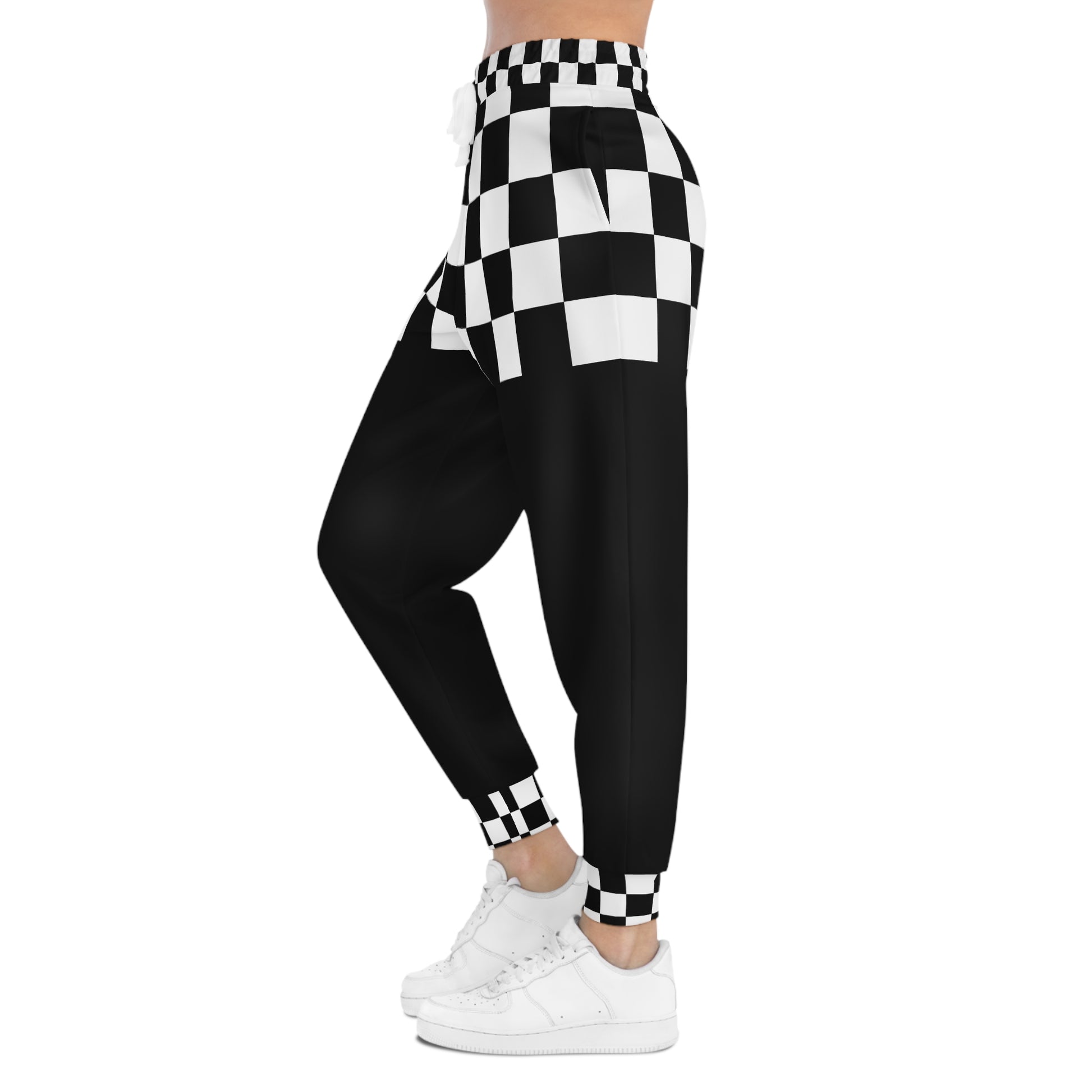 Black and white checkered leggings worn by a person on a white background