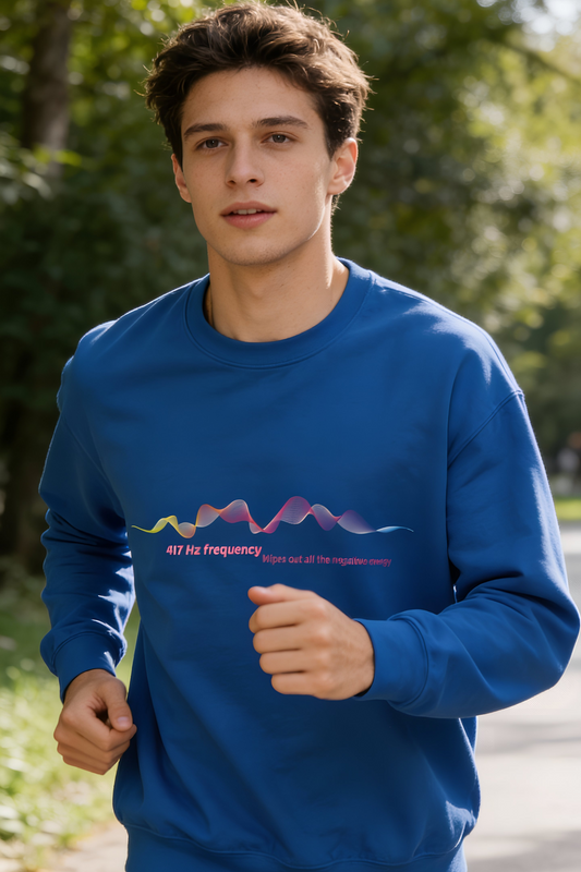 Male model jogging outdoors wearing blue 417 Hz frequency graphic sweatshirt