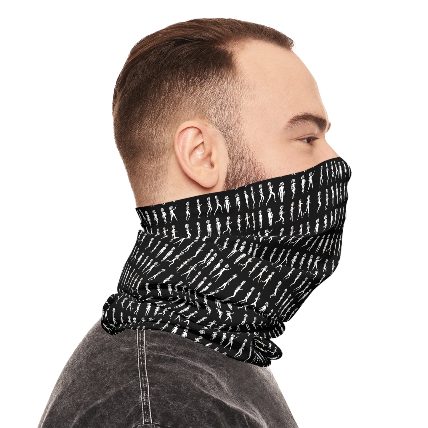Side view of man wearing black patterned tube scarf covering lower face and neck