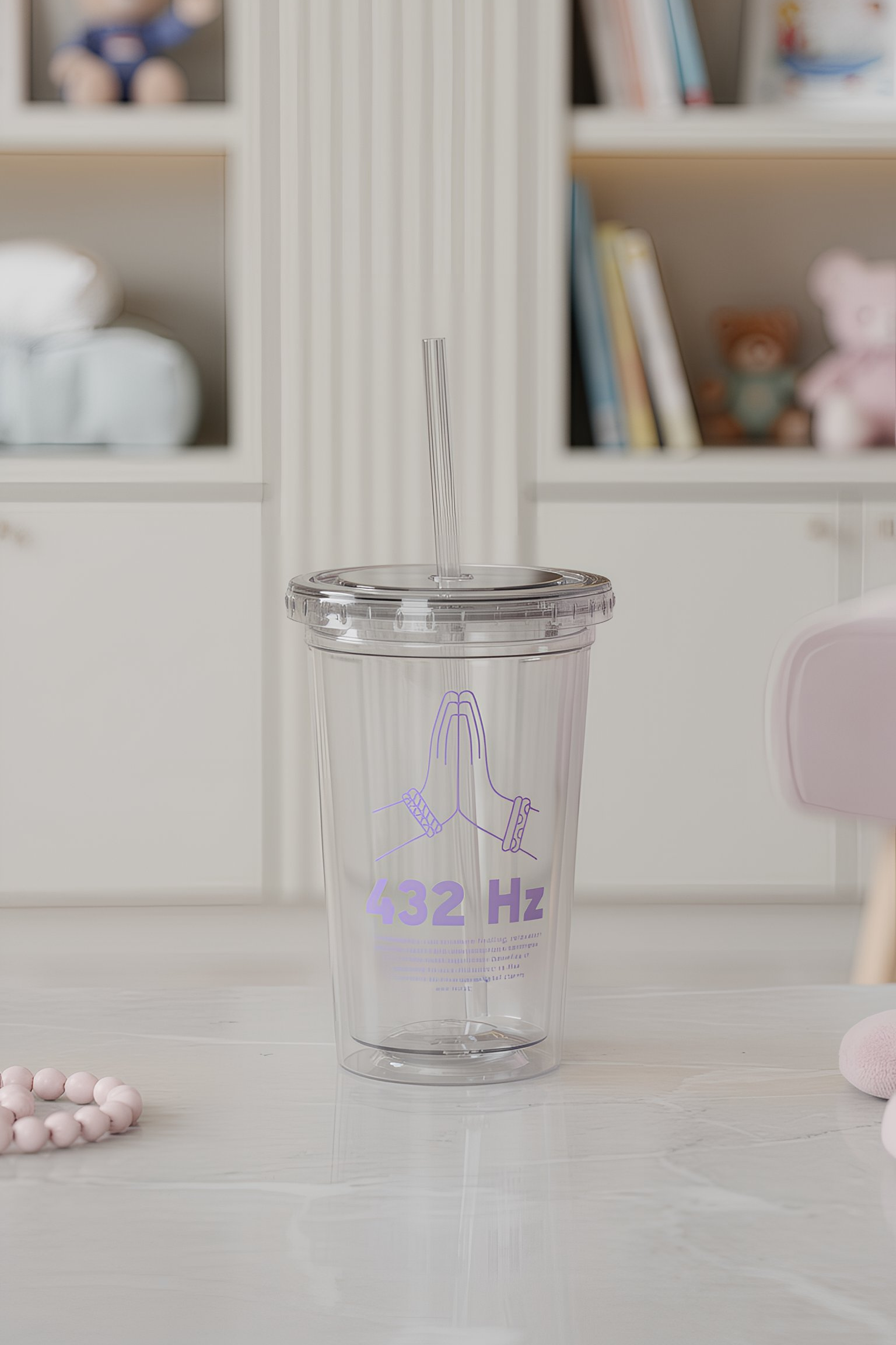 Clear insulated acrylic tumbler with straw on kitchen counter
