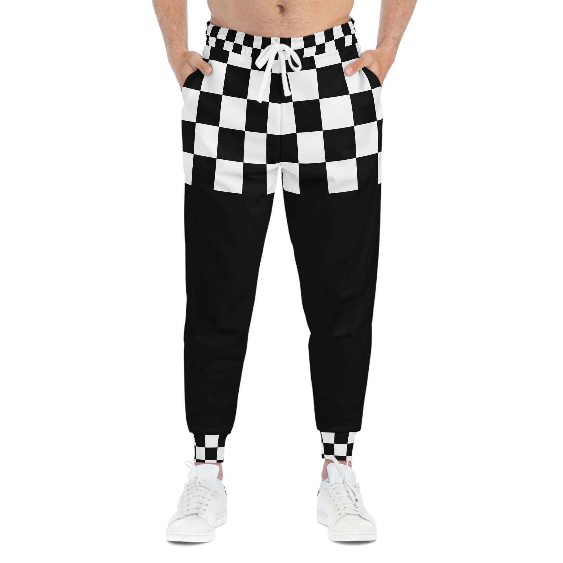 Black and white checkered pants worn by a person on a white background