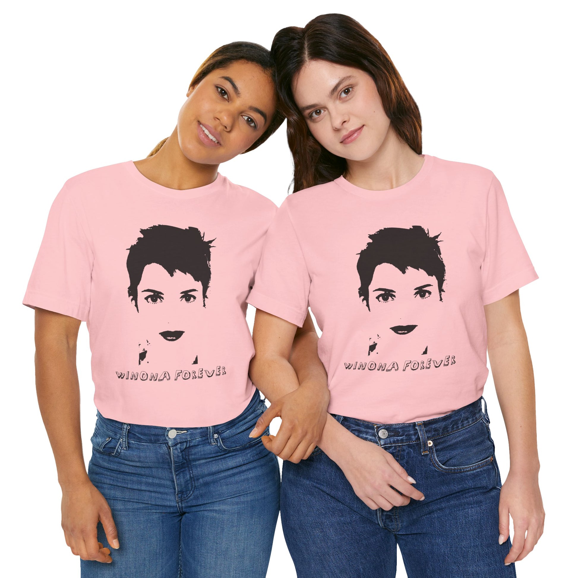 Two people in matching pink Winona Forever T-shirts posing together and smiling.