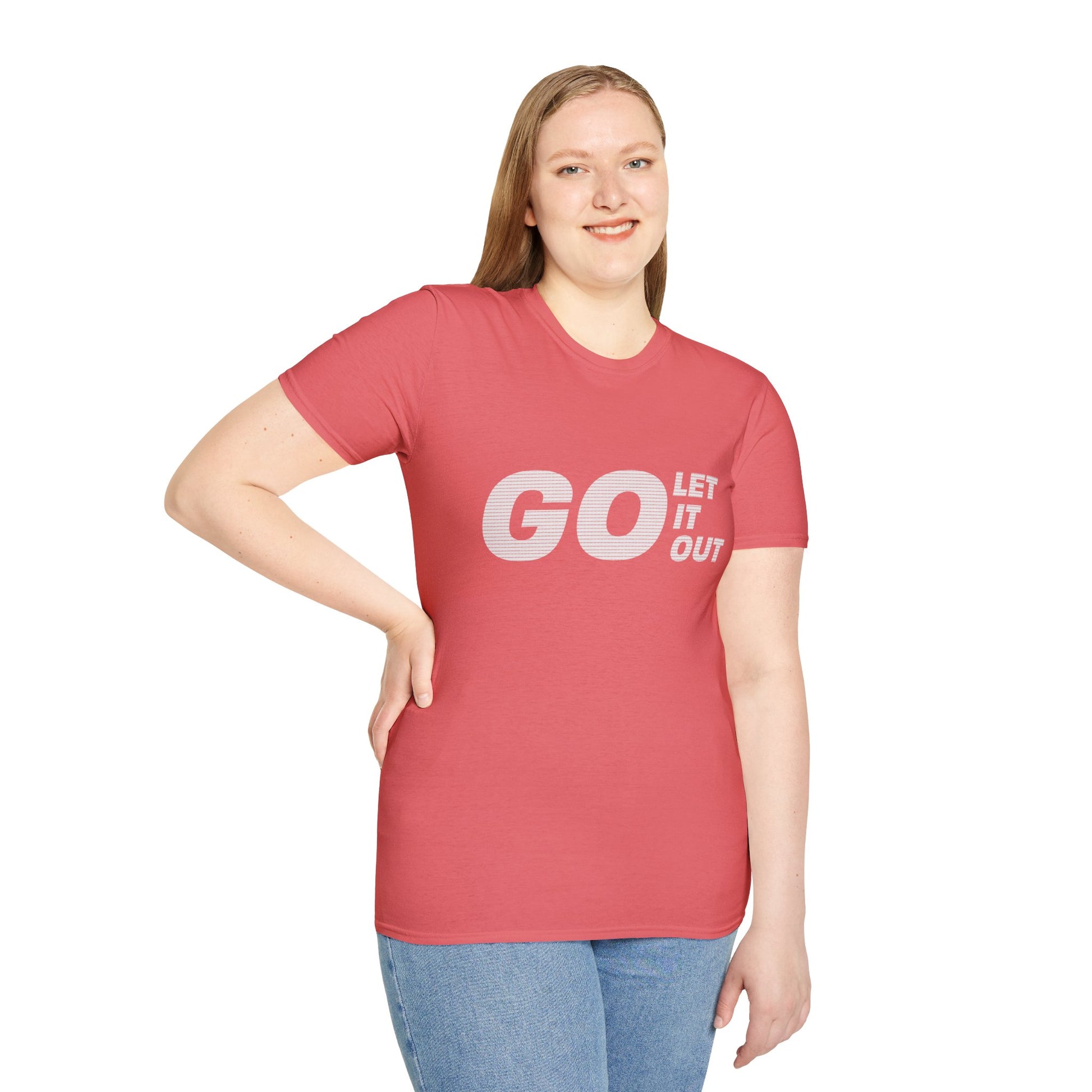 Woman wearing coral pink Oasis Go Let It Out T-shirt, standing with hands at sides