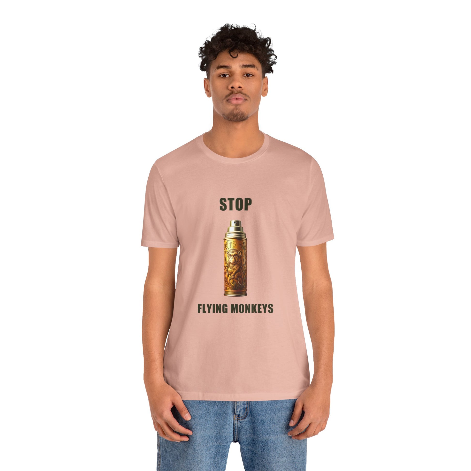 Man wearing peach Stop Flying Monkeys T-Shirt Alternate Version with jeans