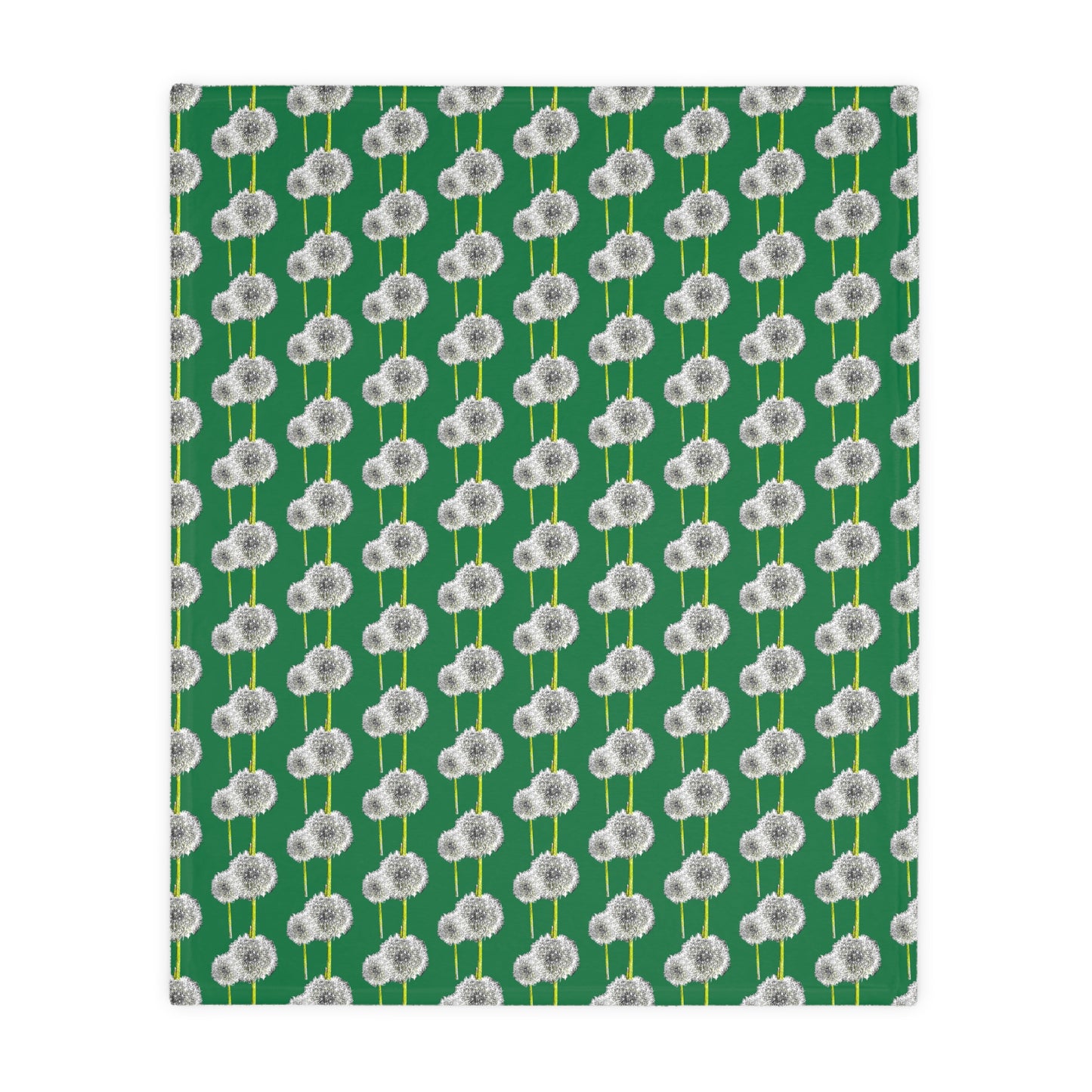 Angled flat view of green blanket with white dandelion print