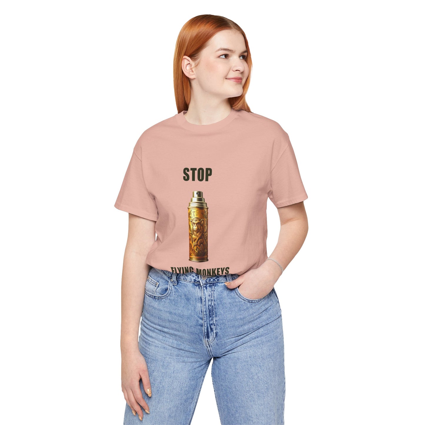 Woman wearing peach Stop Flying Monkeys T-Shirt Alternate Version with jeans