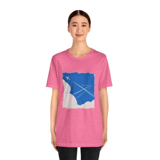 Person wearing a pink t-shirt with a graphic design on a white background
